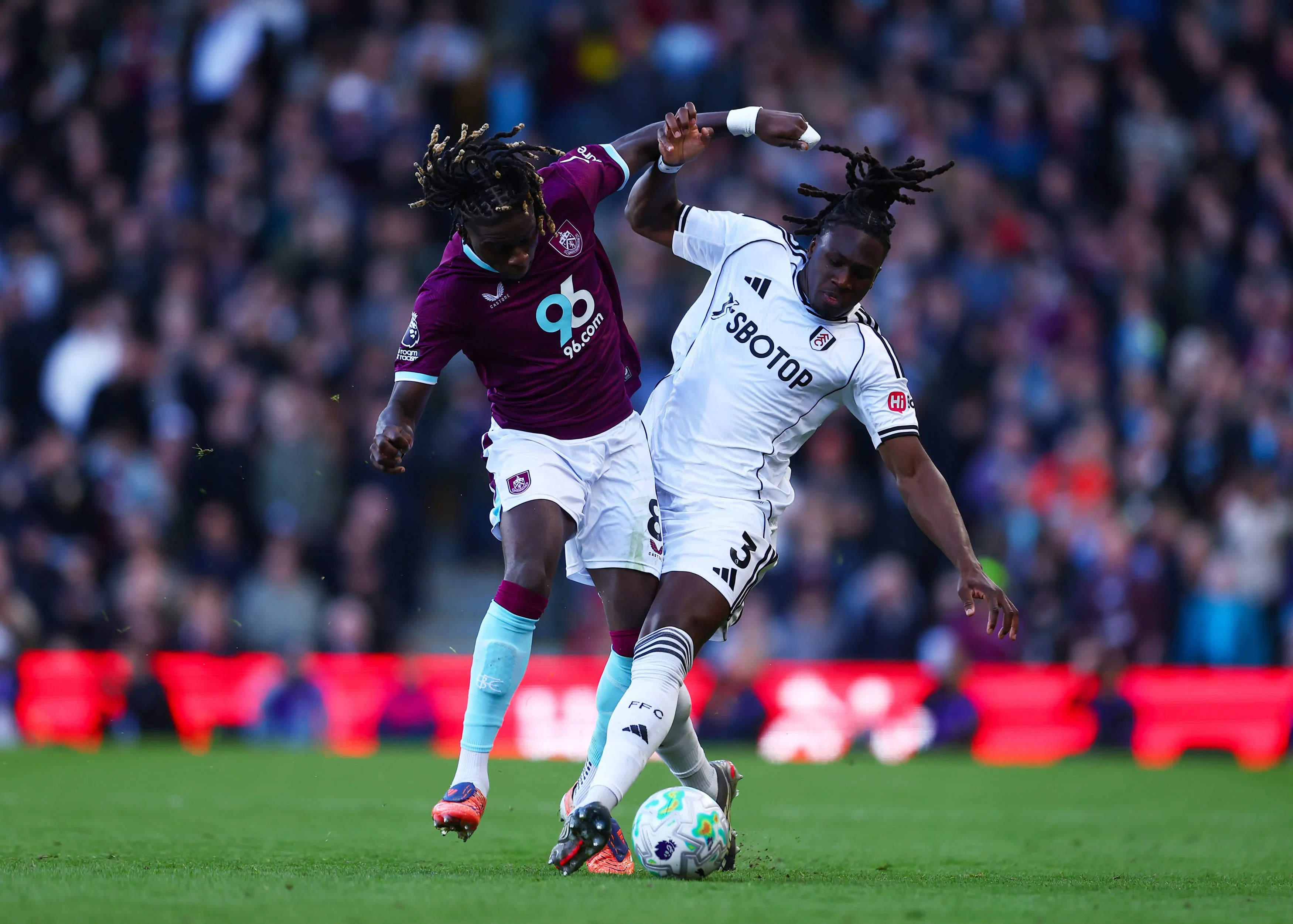 Lesley Ugochukwu under pressure from Calvin Bassey of Fulham