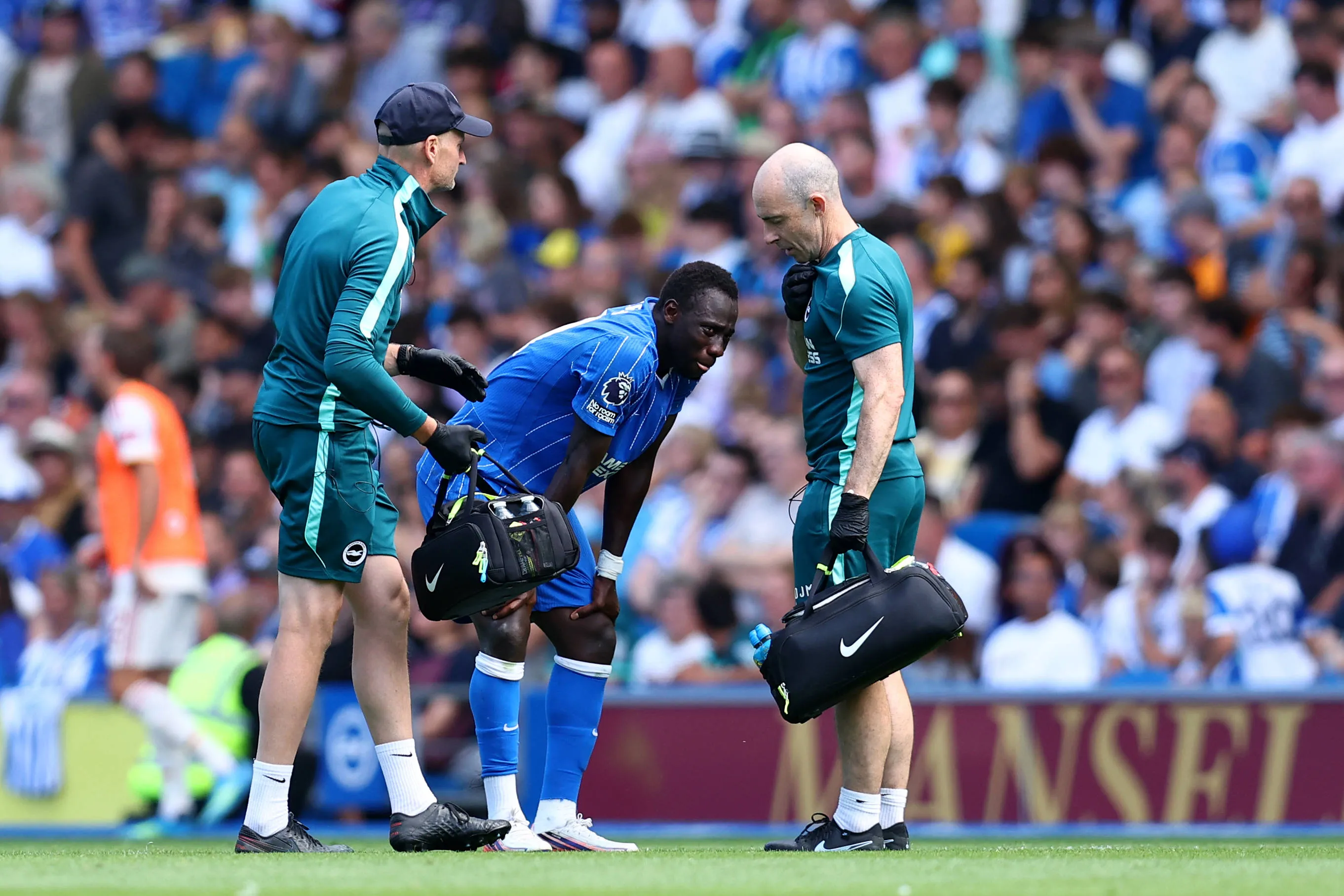 Brighton and Hove, England, 8th August 2026. Yankuba Minteh of Brighton & Hove Albion is helped up by medical staff after receiving medical treatment and then being substituted after picking up an injury during the Brighton and Hove Albion vs AS Roma Pre Season Friendly match at the AMEX Stadium, Brighton and Hove. 