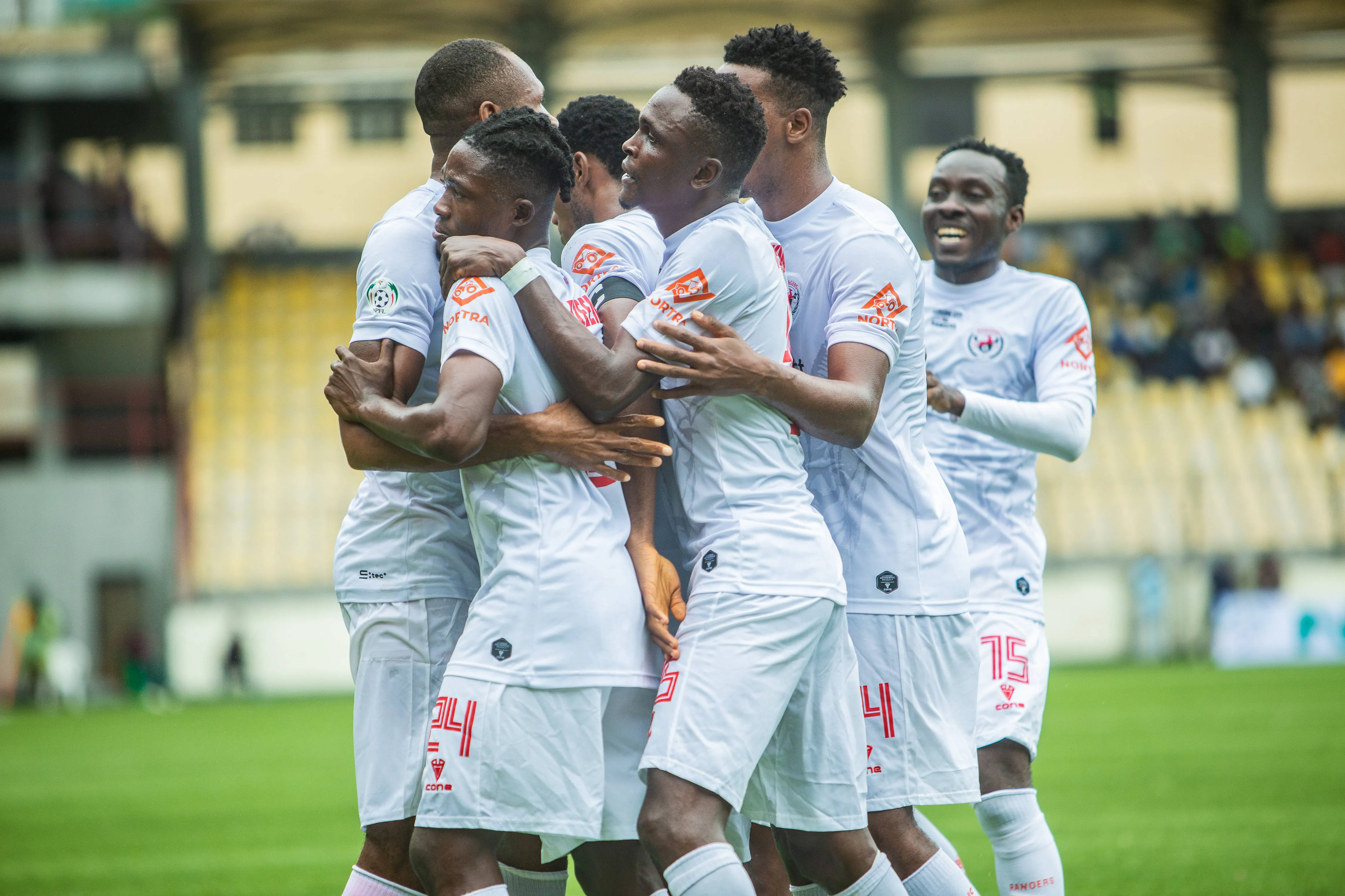 Rangers Int l FC players celebrating their goal.