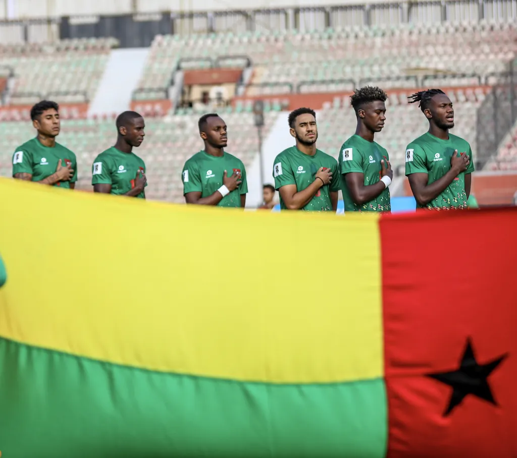 Guinea-Bissau team singing national anthem