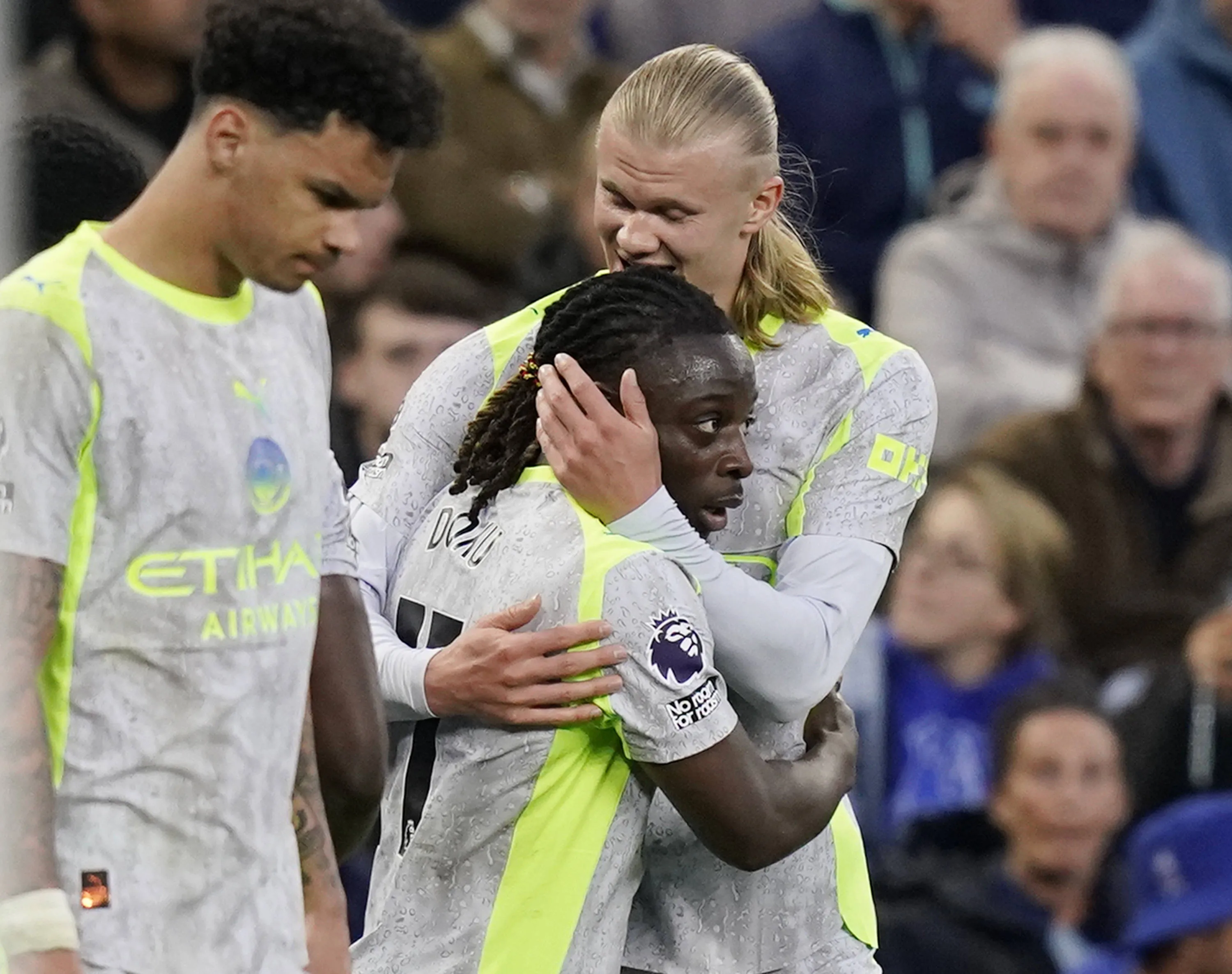 Erling Haaland of Manchester City hugs goalscorer Jeremy Doku