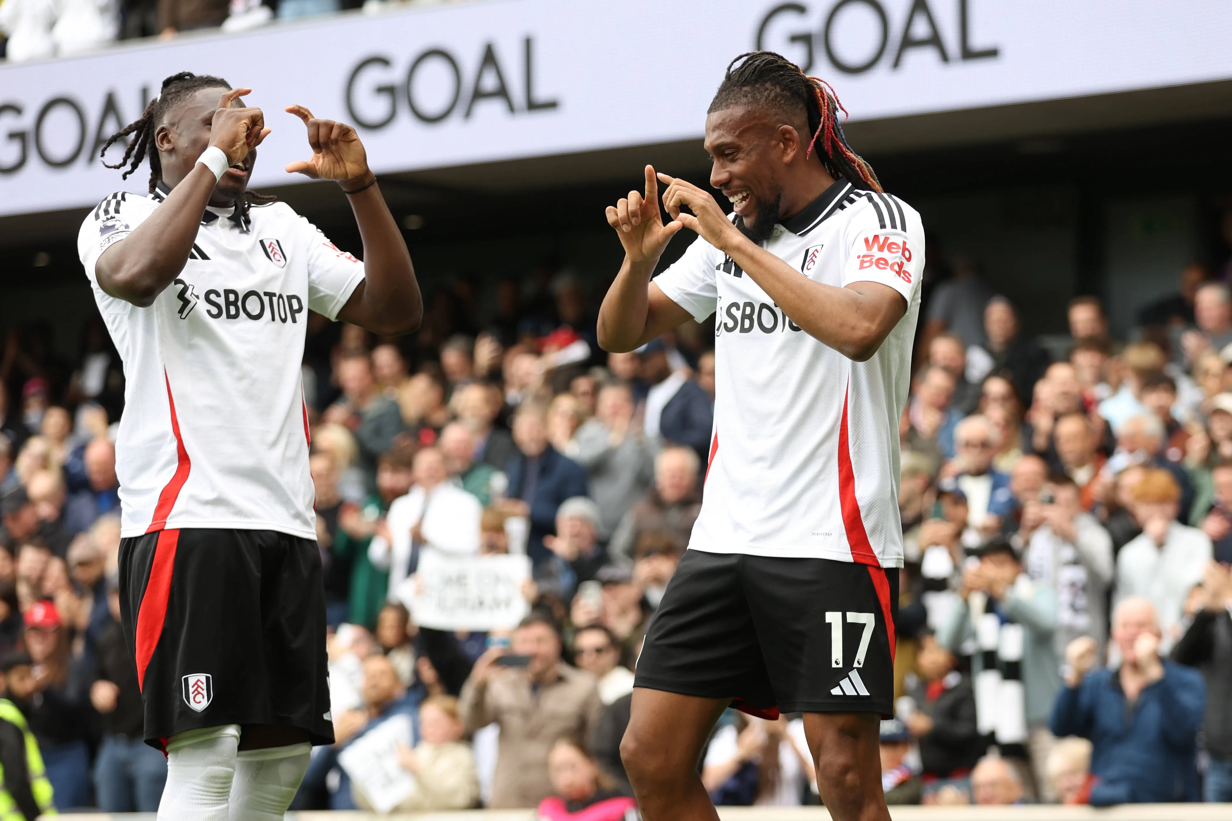  Calvin Bassey and Alex Iwobi of Fulham goal celebrations during the Premier League match between Fulham and Chelsea.