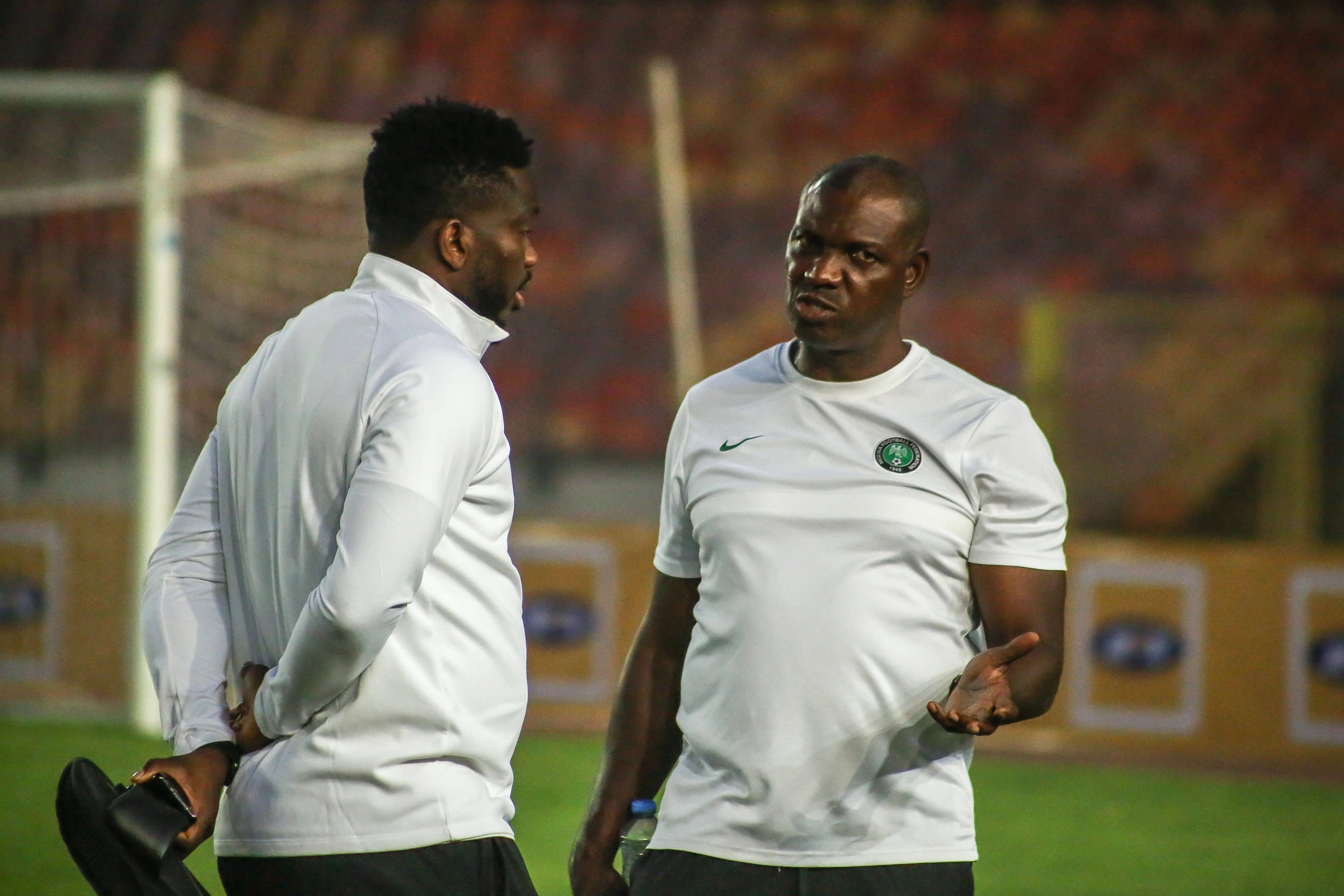Coach Augustine Eguavoen rt and Yobo Joseph of Nigeria.