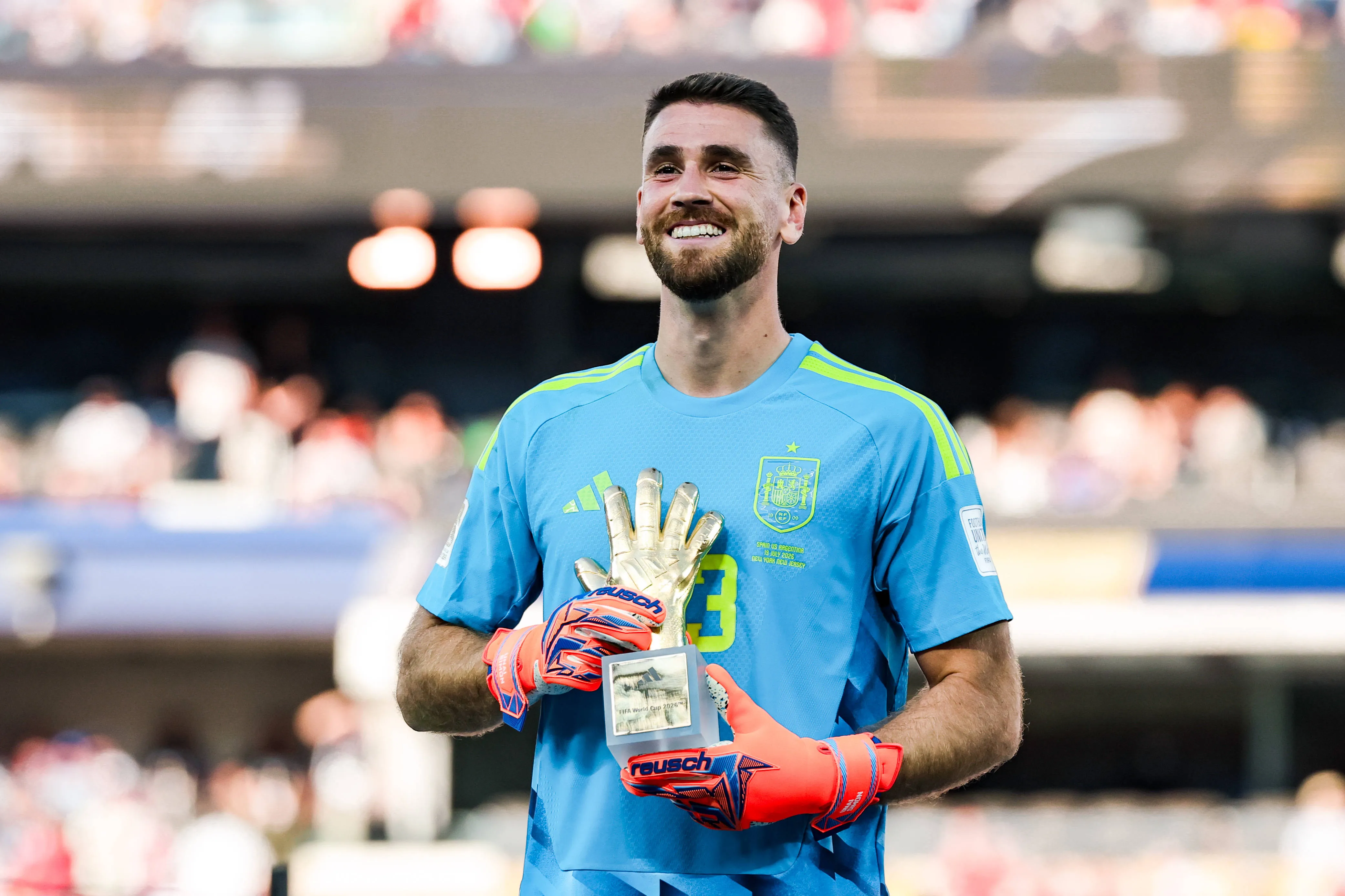 Unai Simon of Spain poses with the World Cup Golden Glove award