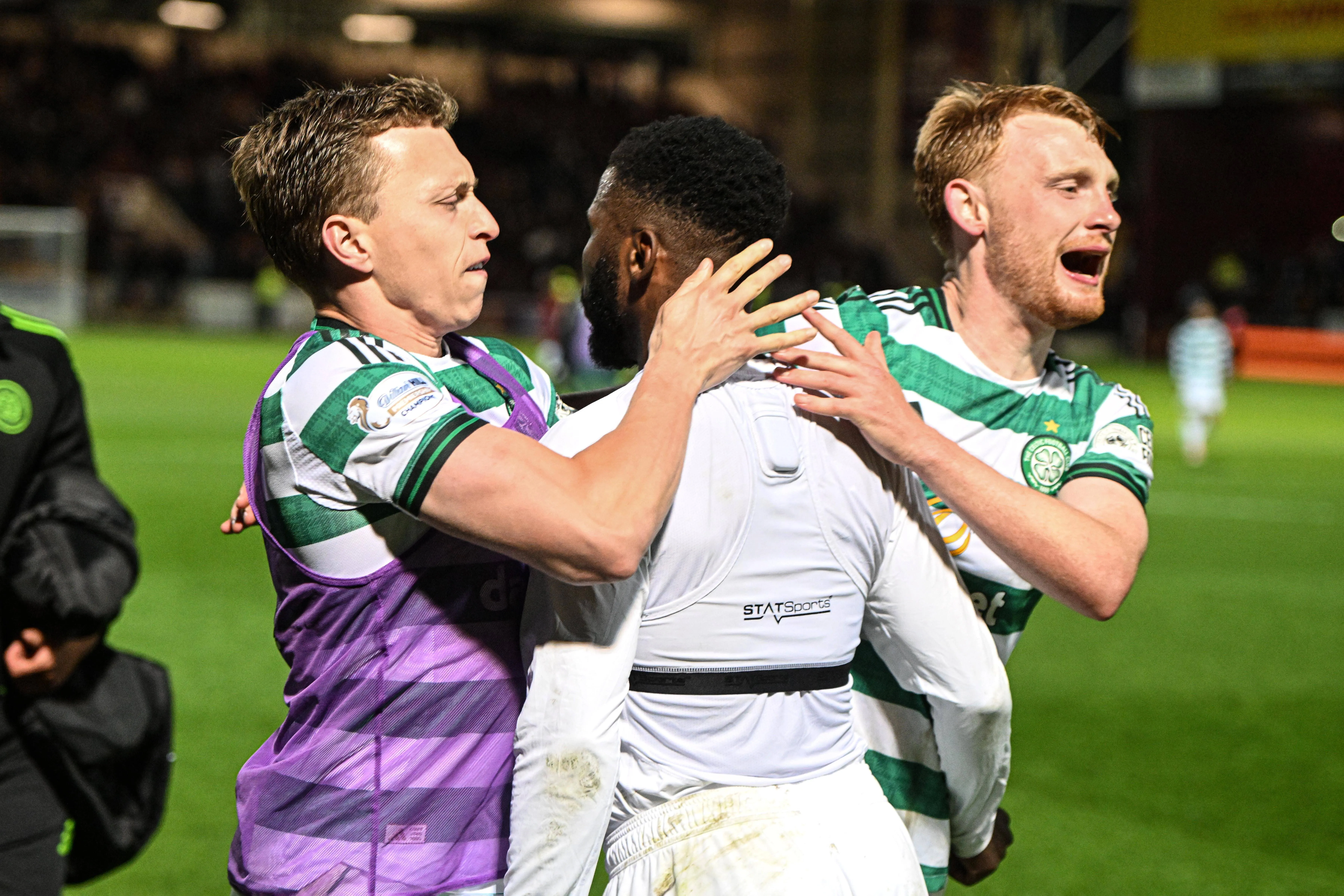 Kelechi Iheanacho of Celtic celebrates at full time with Alistair Johnston and Liam Scales