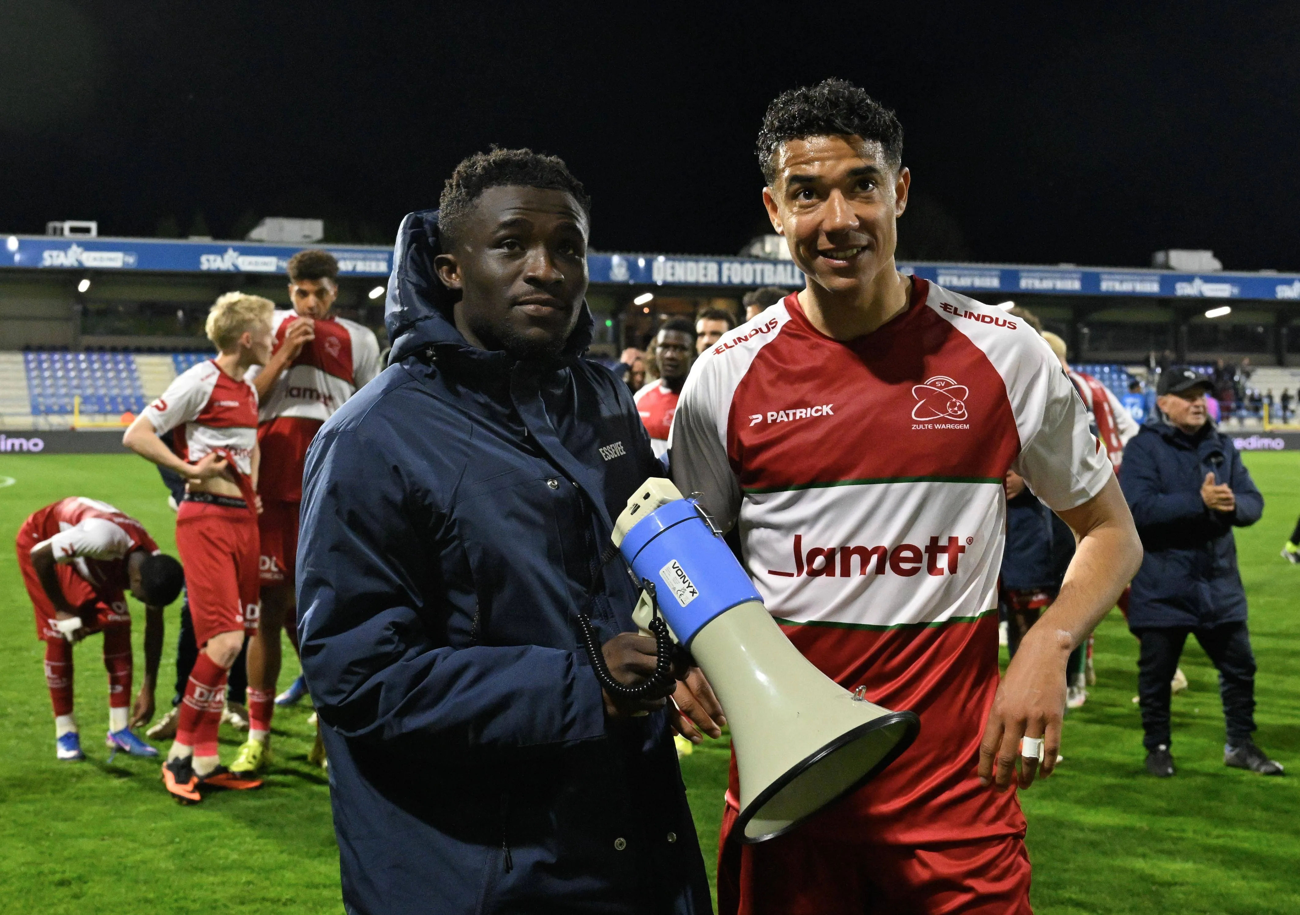 Joseph Opoku and Anosike Ementa celebrate after winning against FCV Dender EH