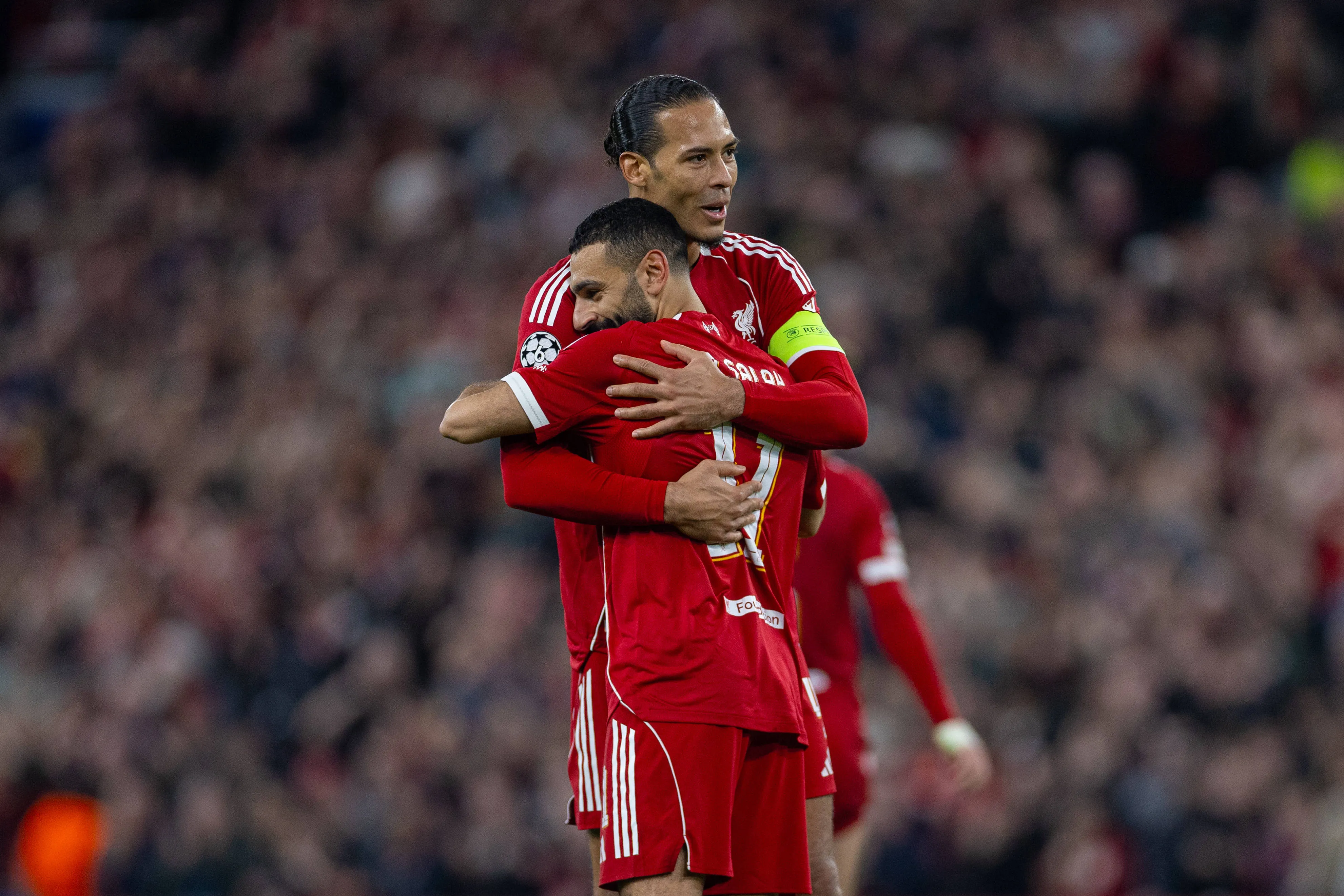 Liverpool's Mohamed Salah celebrates with team-mate captain Virgil van Dijk
