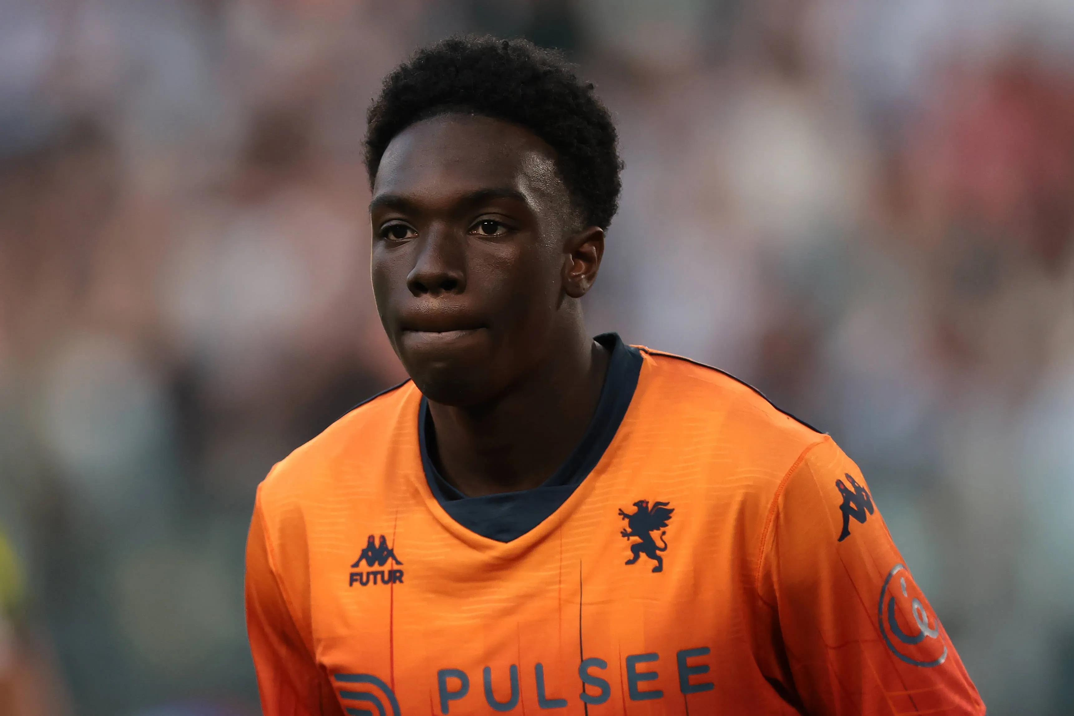 Jeff Ekhator of Genoa looks on