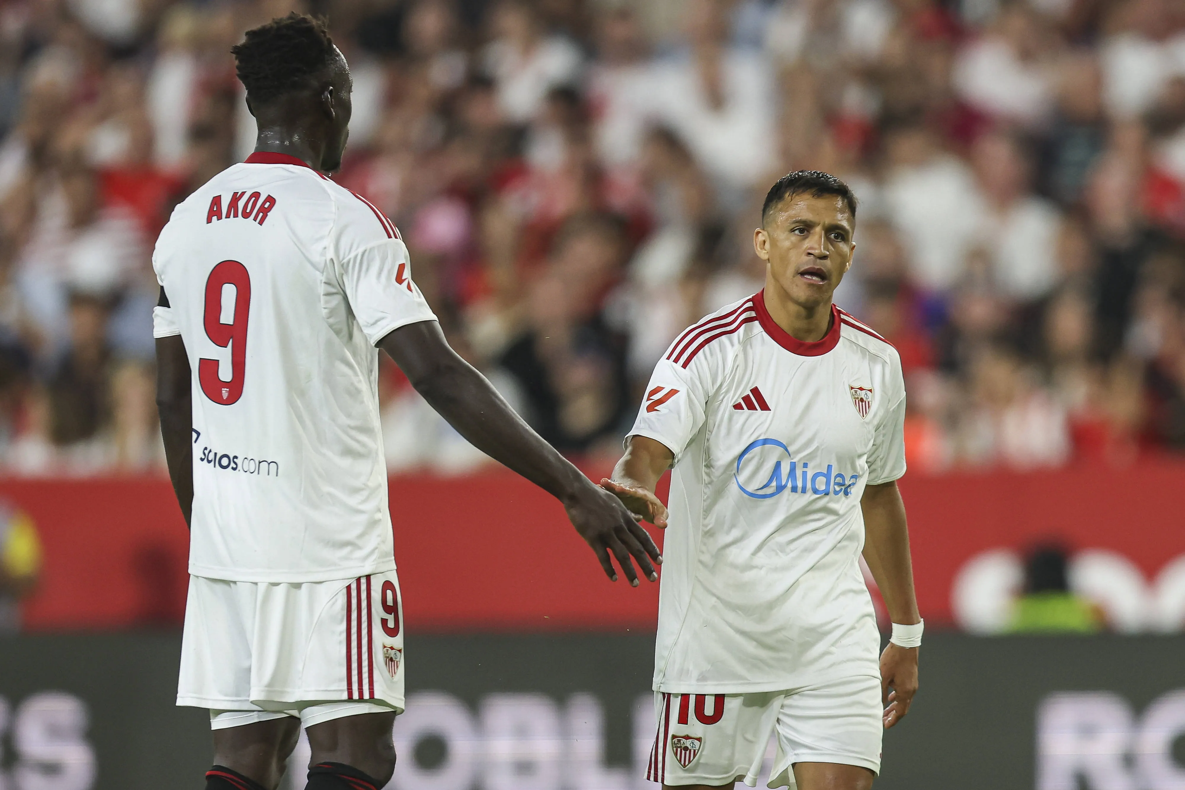 Akor Adams and Alexis Sanchez of Sevilla