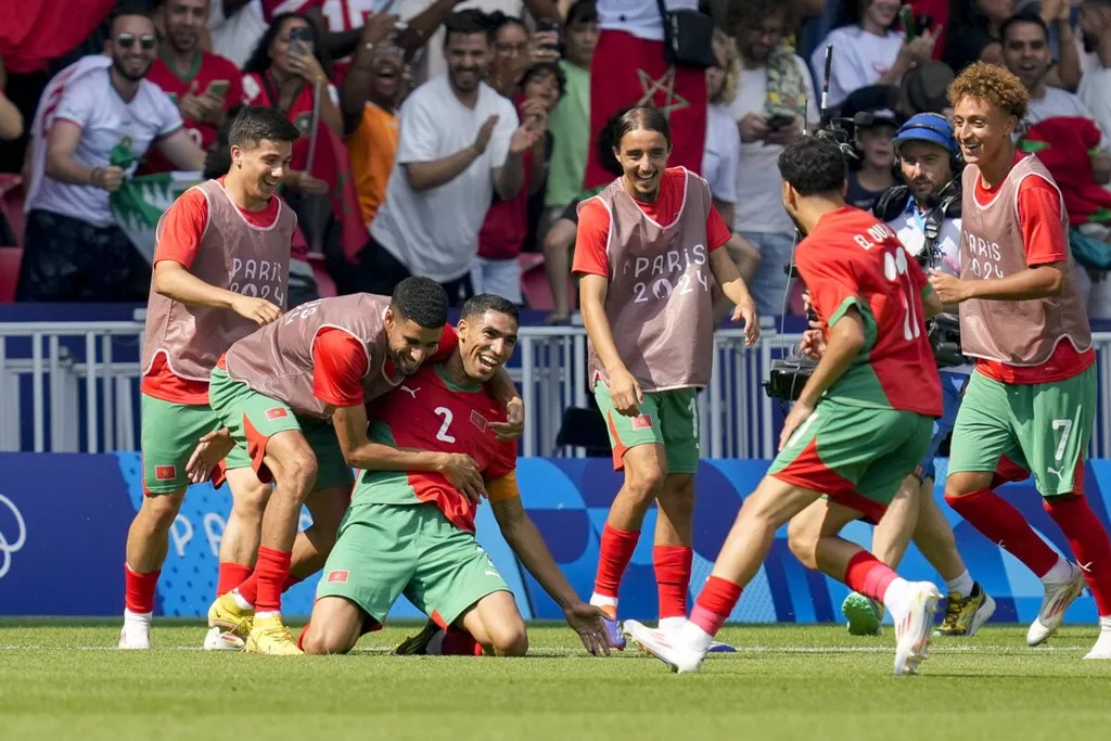 Achraf Hakimi celebrates after scoring his team's third goal with teammates