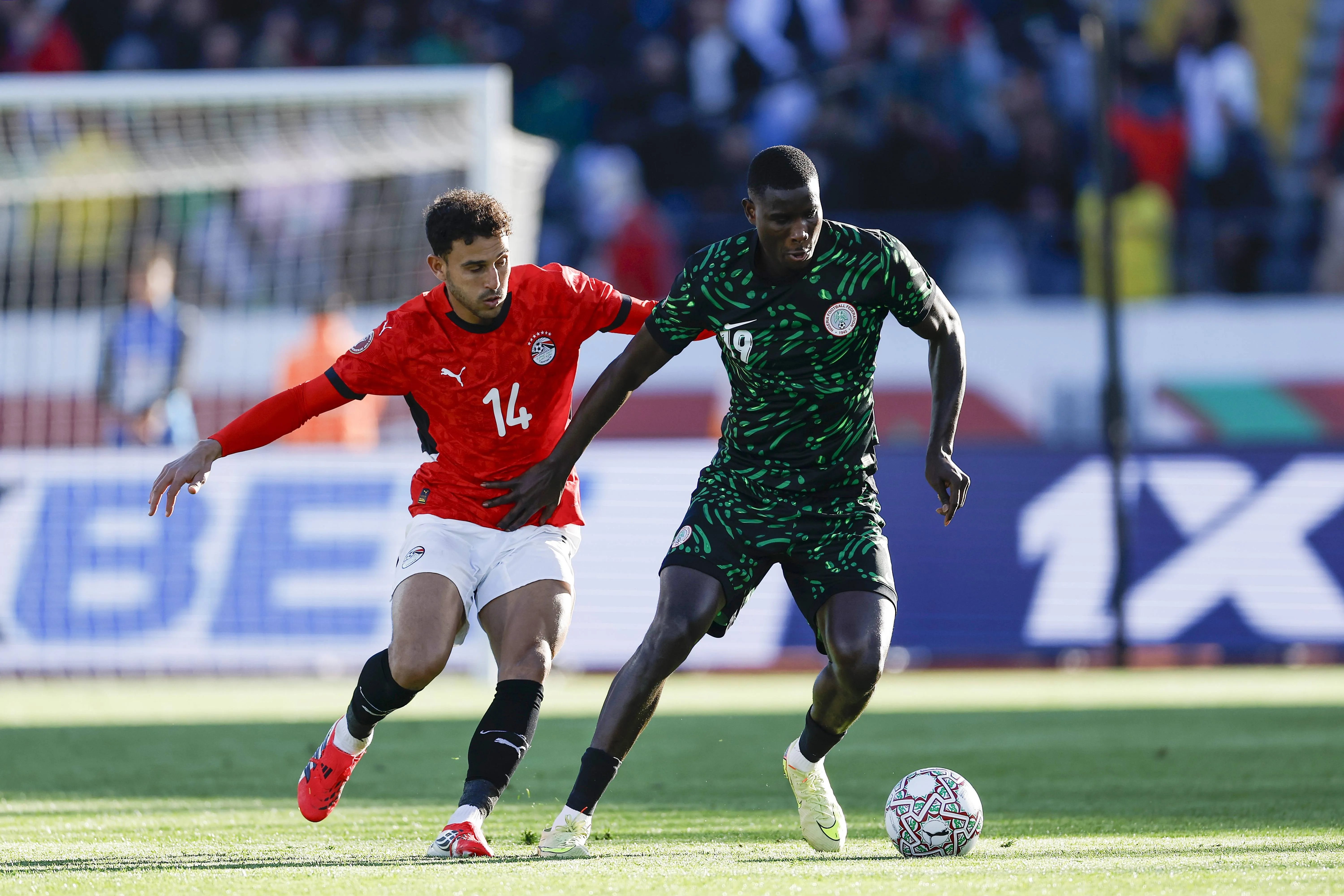 Hamdi Fathi and Paul Onuachu during the AFCON