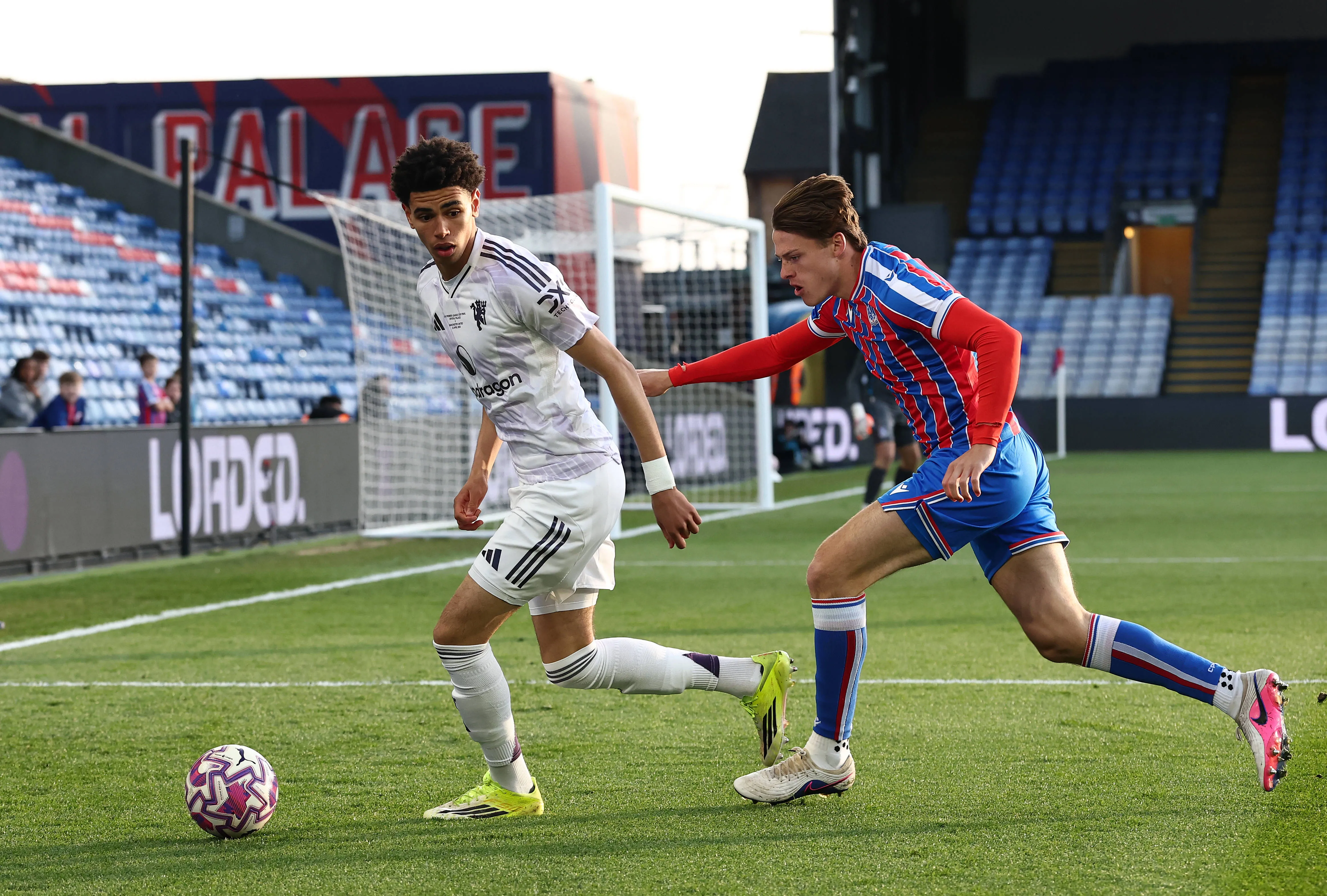Crystal Palace's Charlie Walker-Smith with Manchester United, Noah Ajayi.