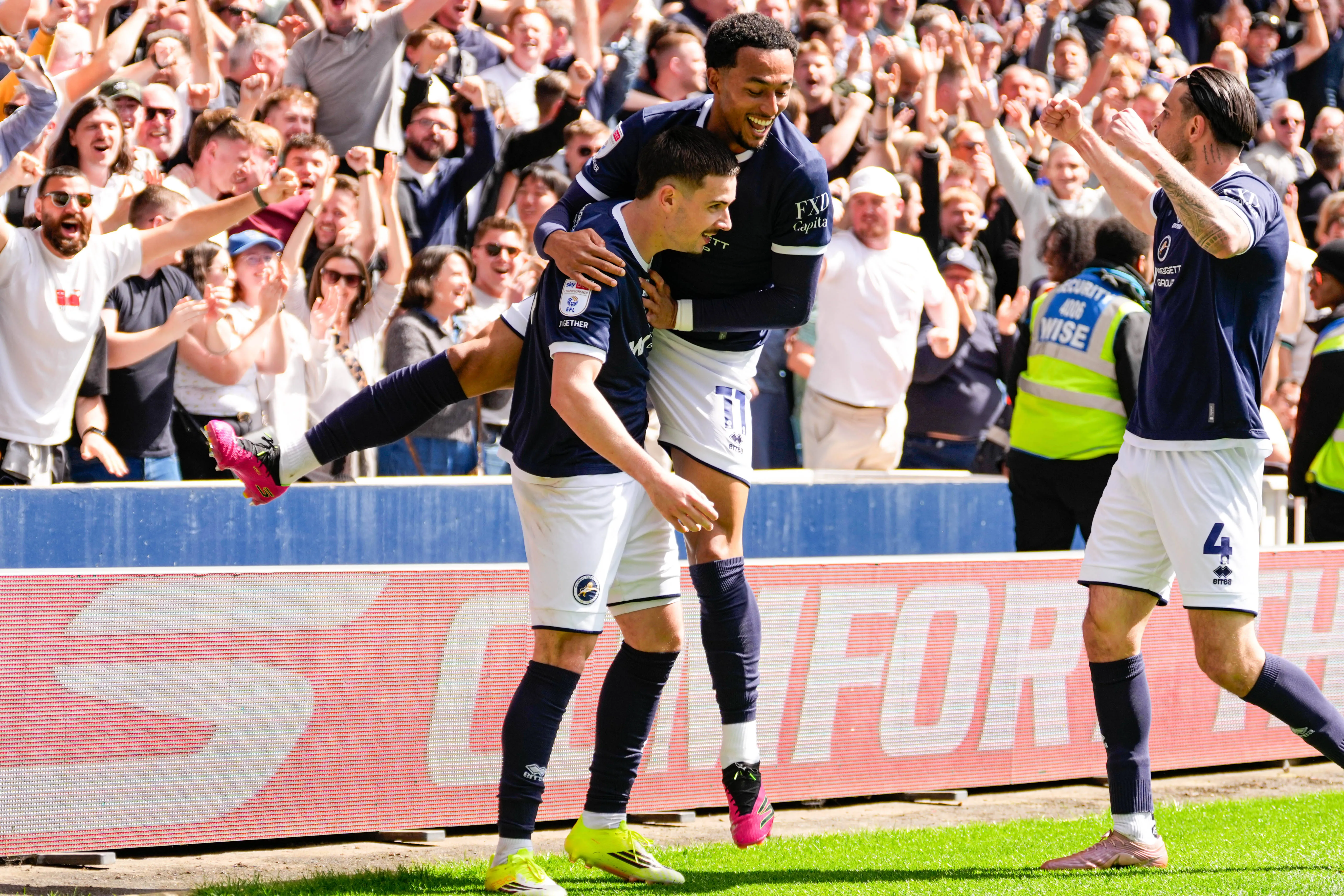,Millwall versus Queens park Rangers Femi Azeez of Millwall celebrates with Camiel Neghli of Millwall after scoring his sides second goal for 2-0 in the 17th minute