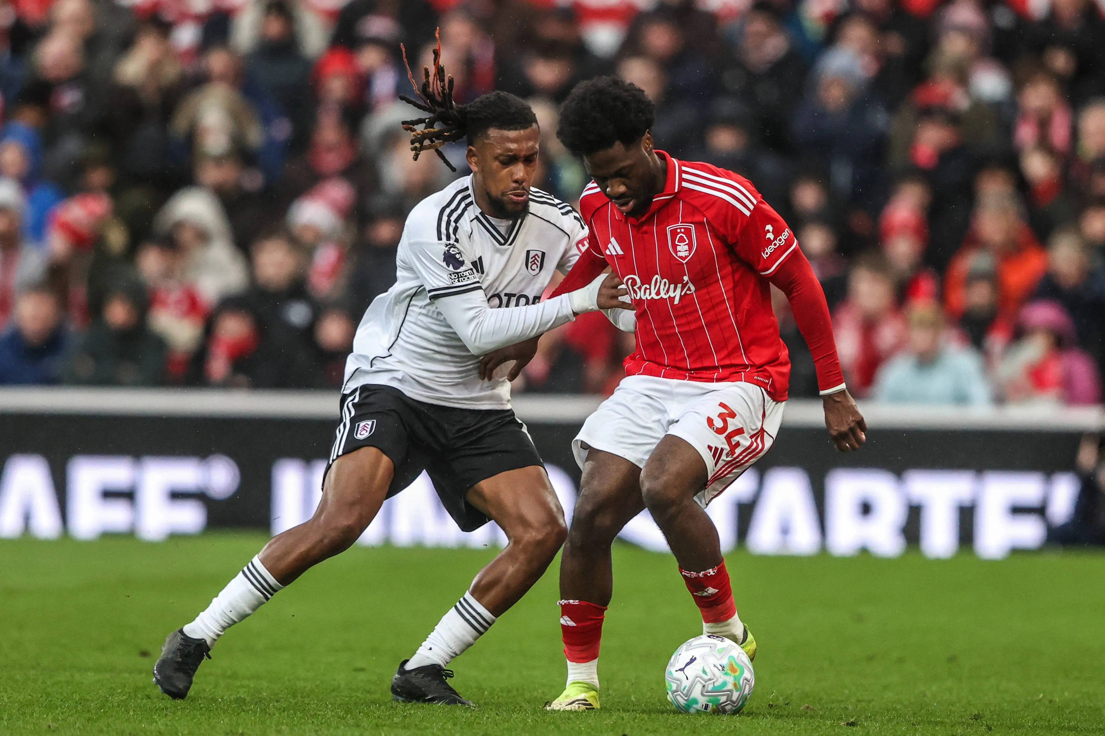 Fulham's Alex Iwobi and Nottingham Forest defender Ola Aina