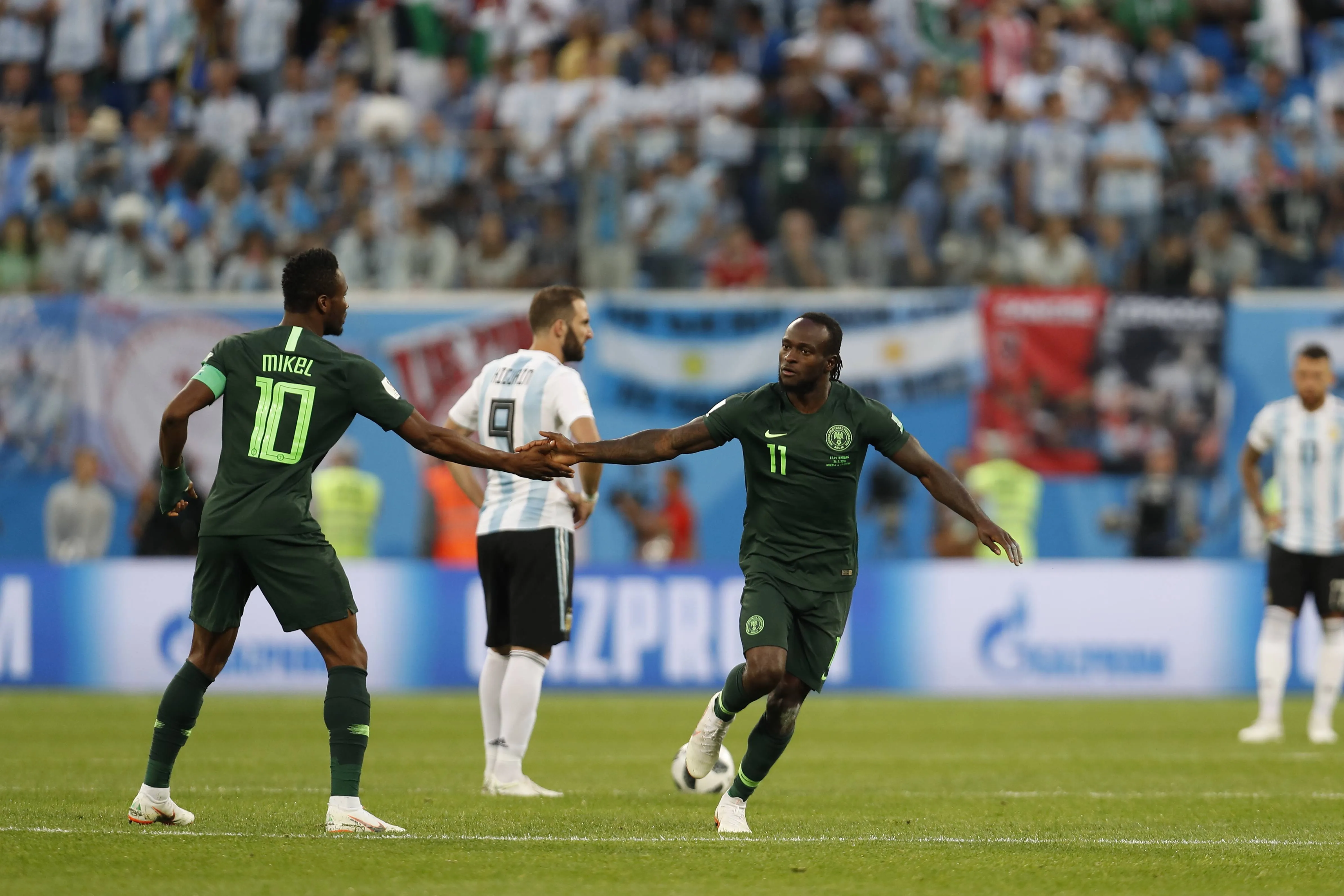 John Obi Mikel and Victor Moses in action for the Super Eagles of Nigeria