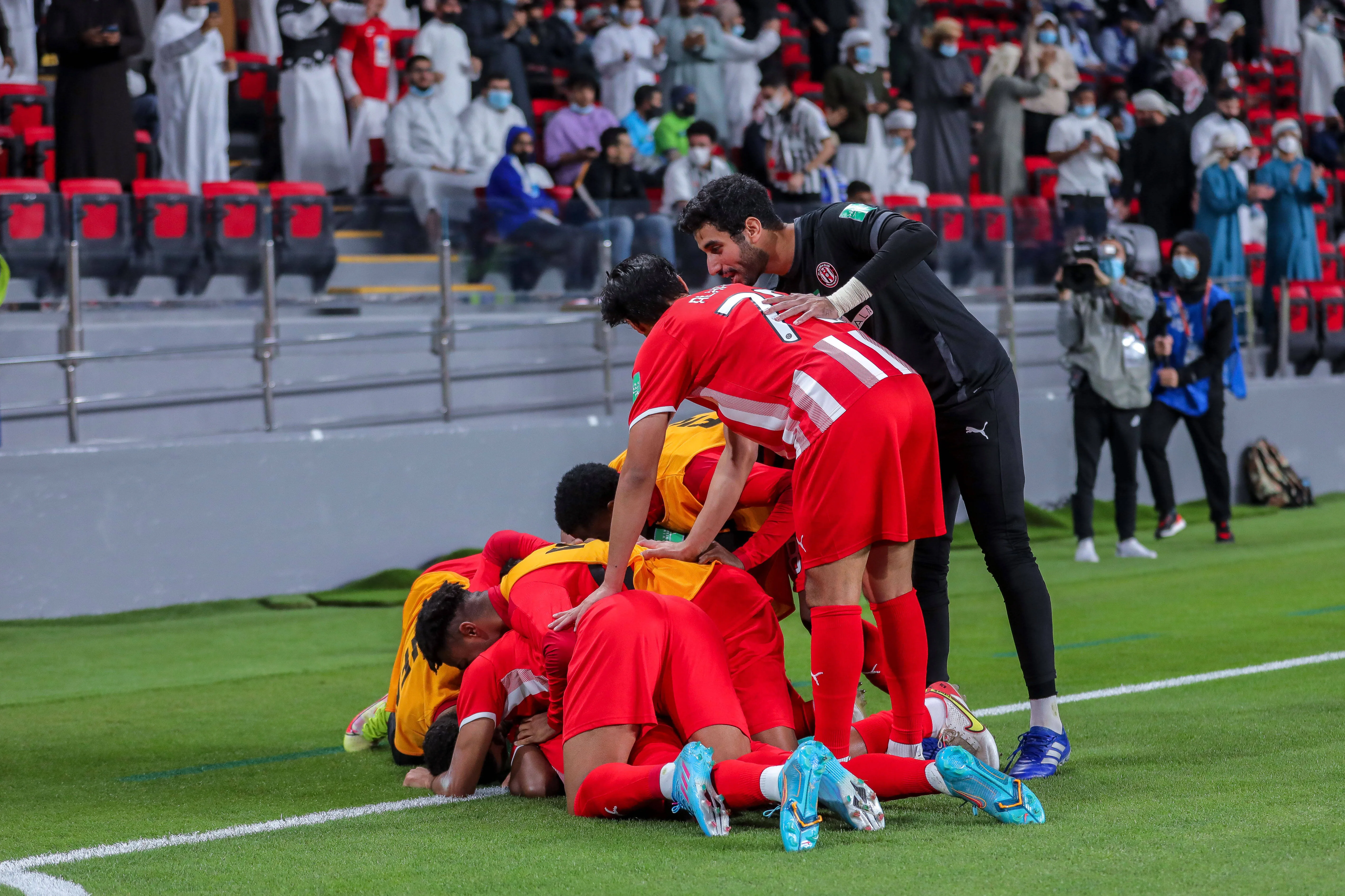 Al Jazira players celebrate.