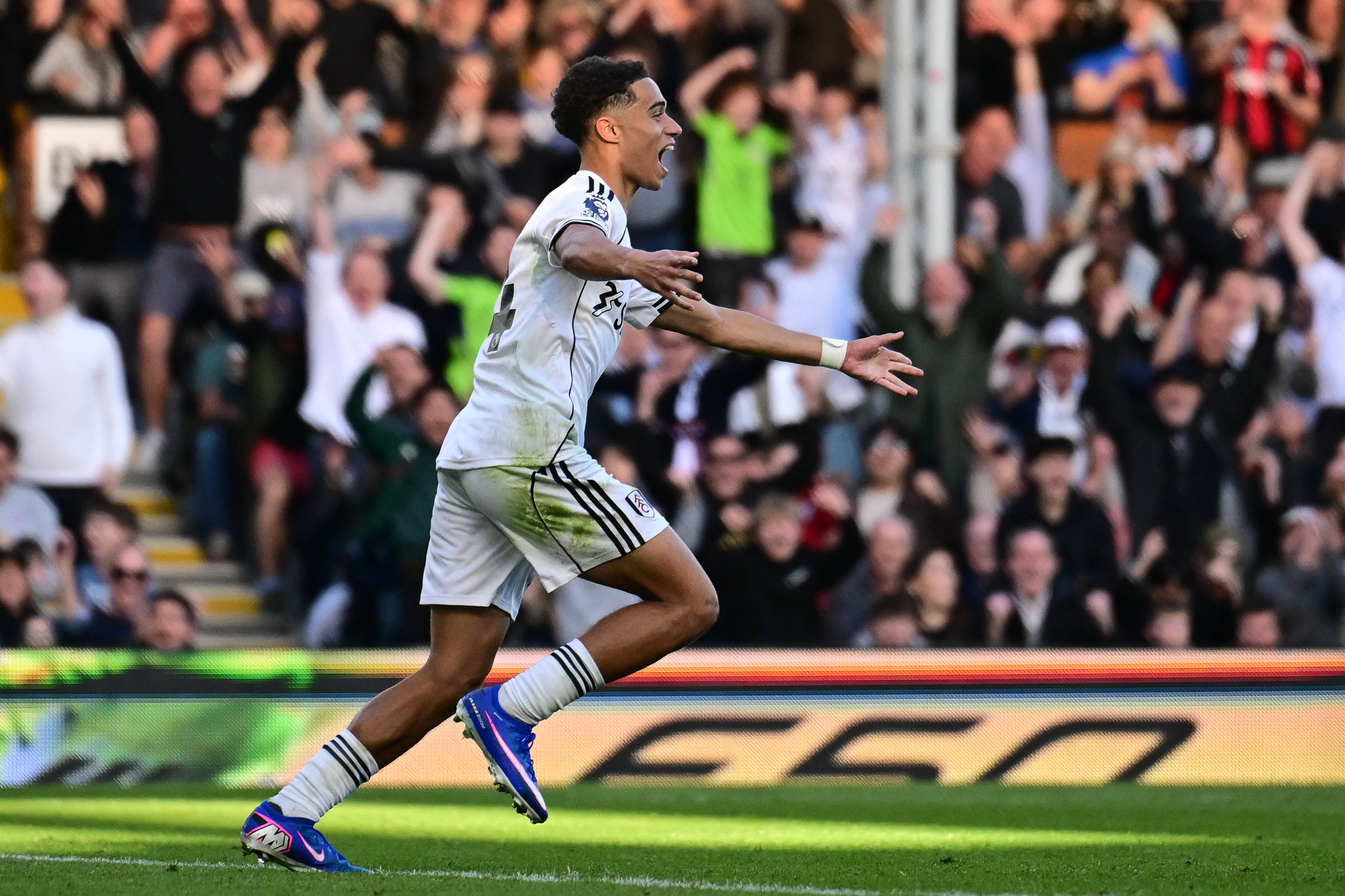 Josh King scores a goal and celebrates during the Premier League match between Fulham and Burnley