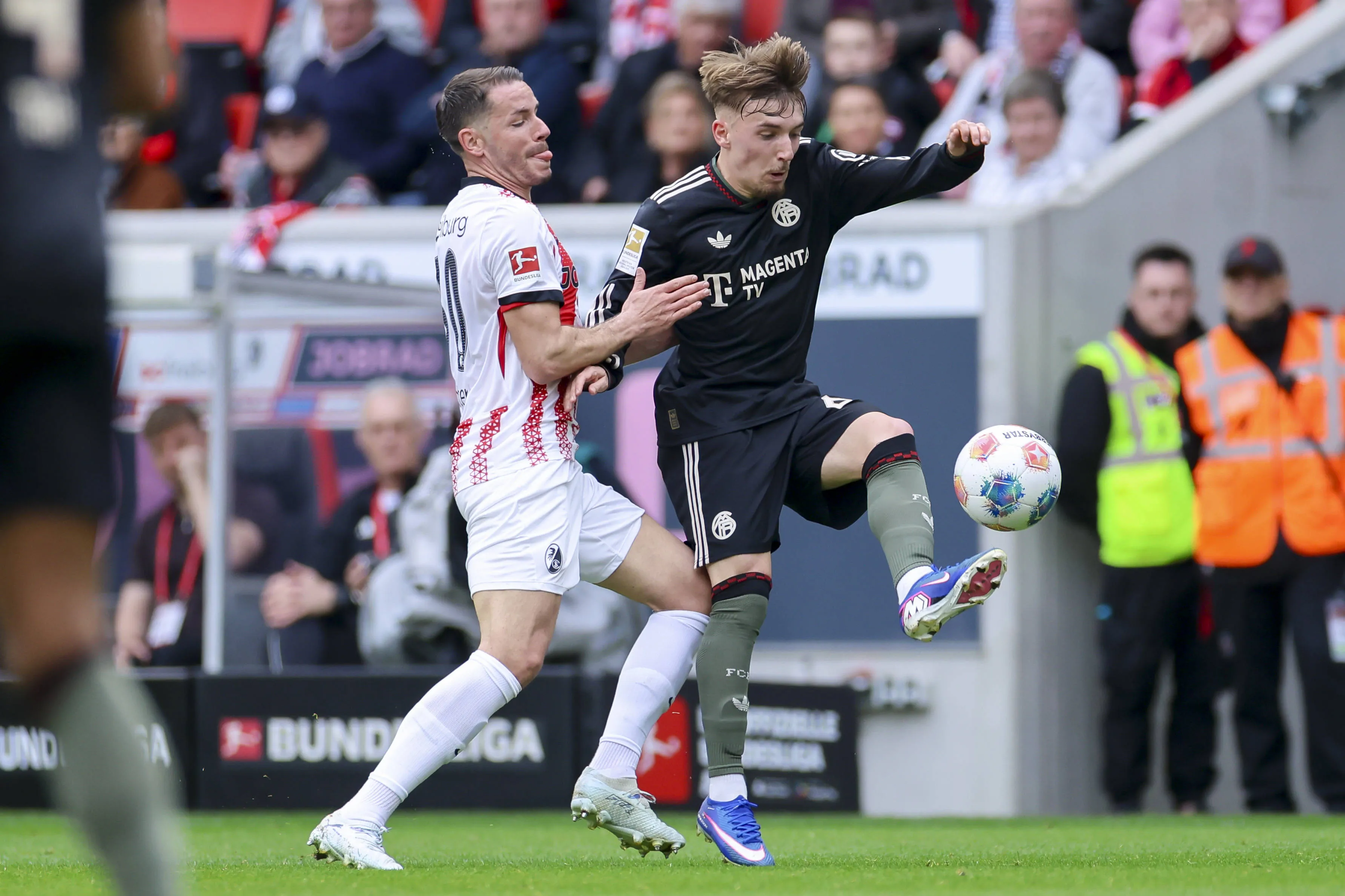 Christian Guenter and Lennart Karl battle in SC Freiburg vs Bayern