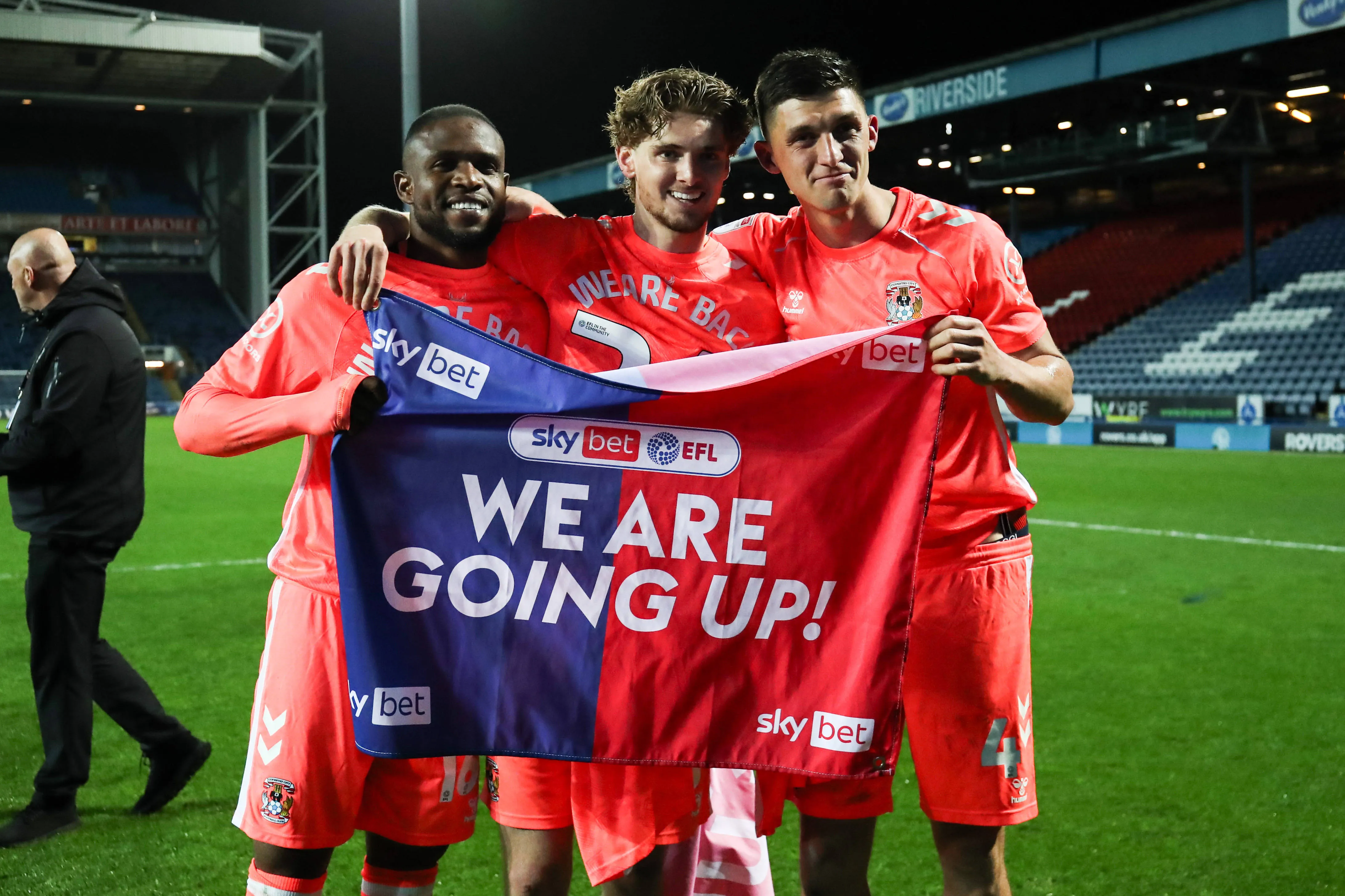 Frank Onyeka of Coventry City and Jack Rudoni of Coventry City and Bobby Thomas of Coventry City celebrates promotion back to the Premier League 