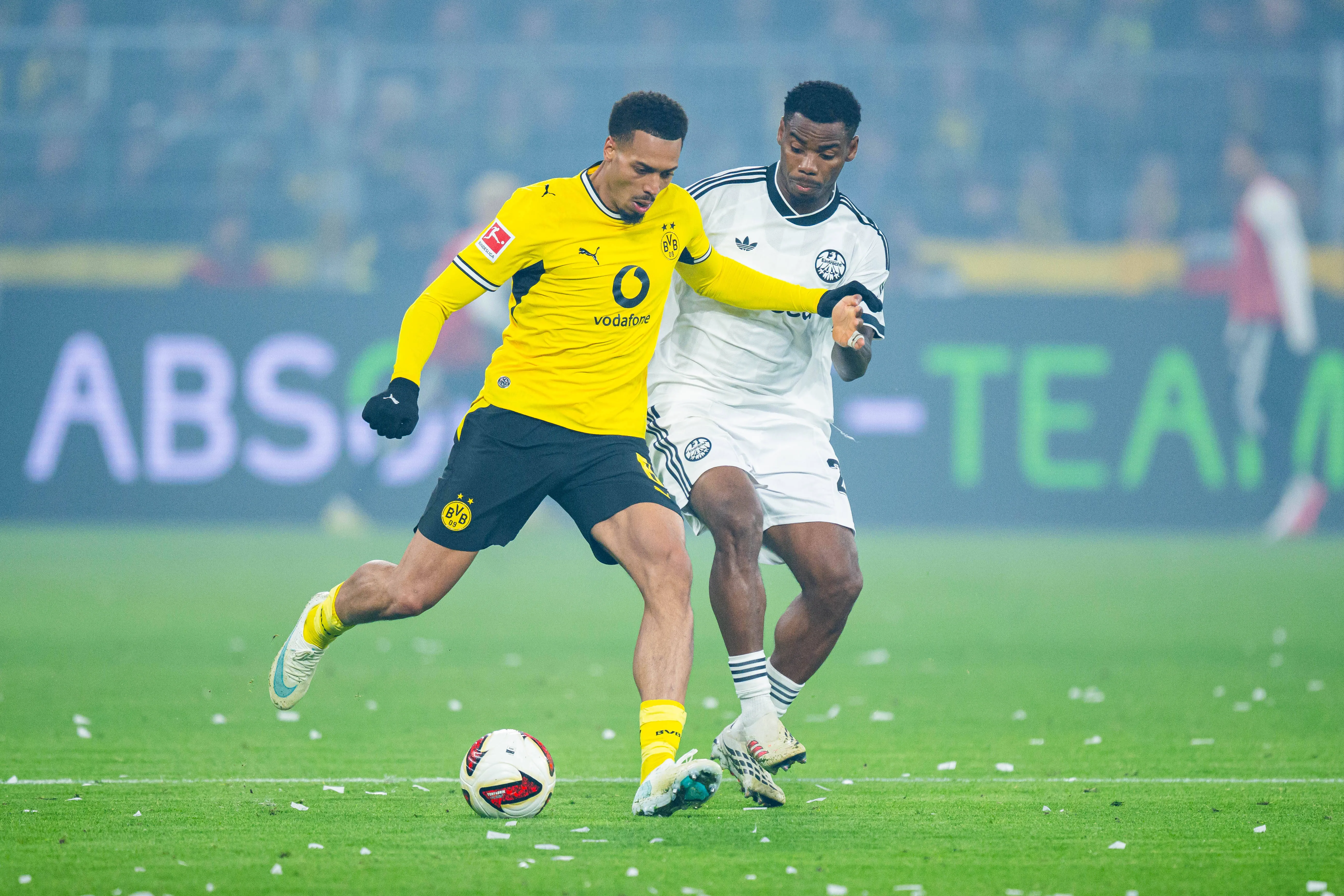 Felix Nmecha of Dortmund and Raphael Onyedika of Frankfurt