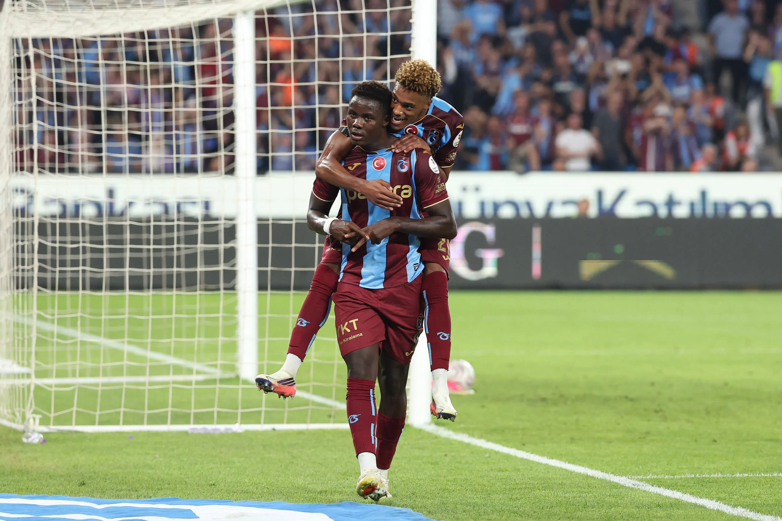 Franculino Dju 9 of Trabzonspor celebrates with teammate.