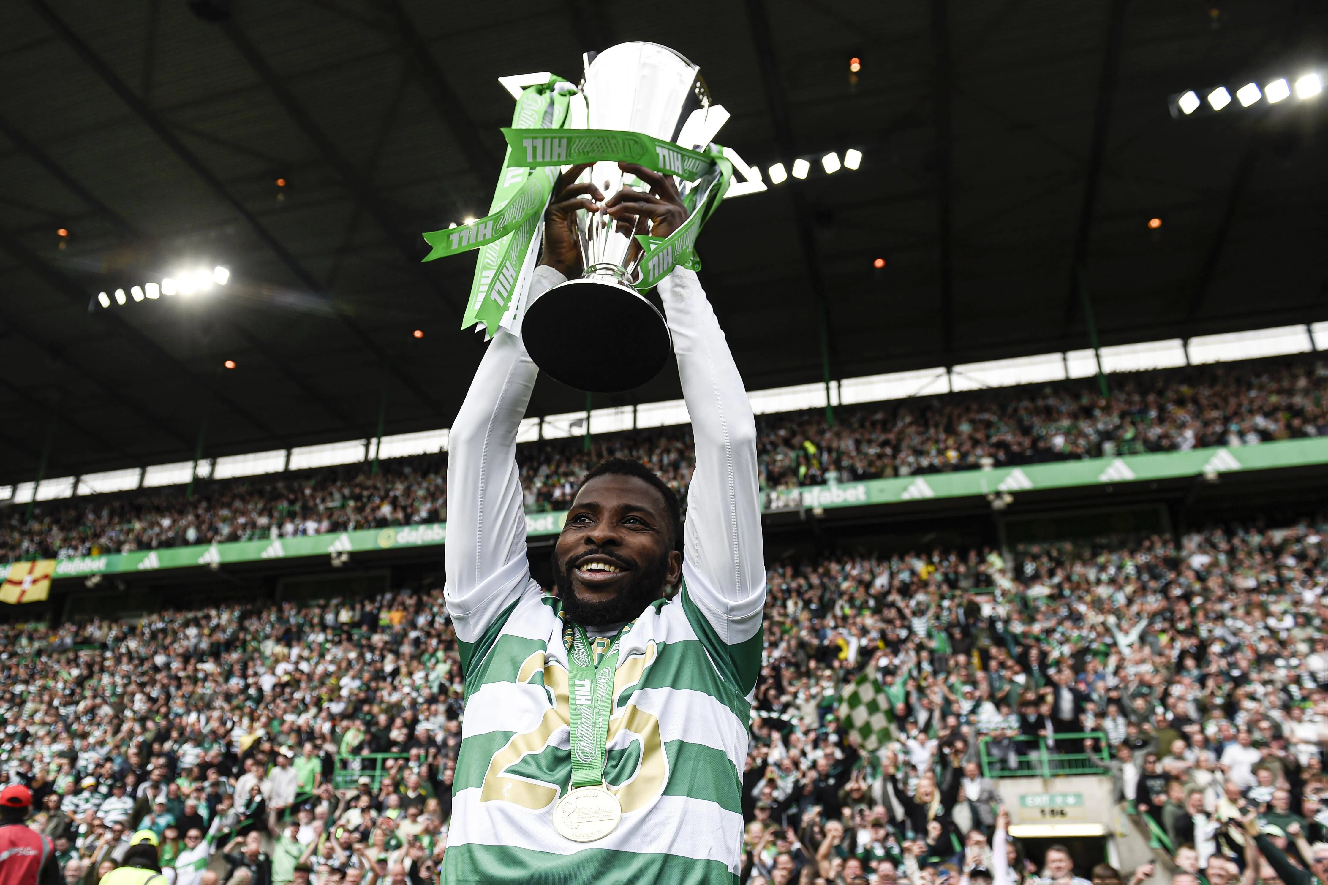 Kelechi Iheanacho of Celtic poses with the William Hill Premiership Trophy