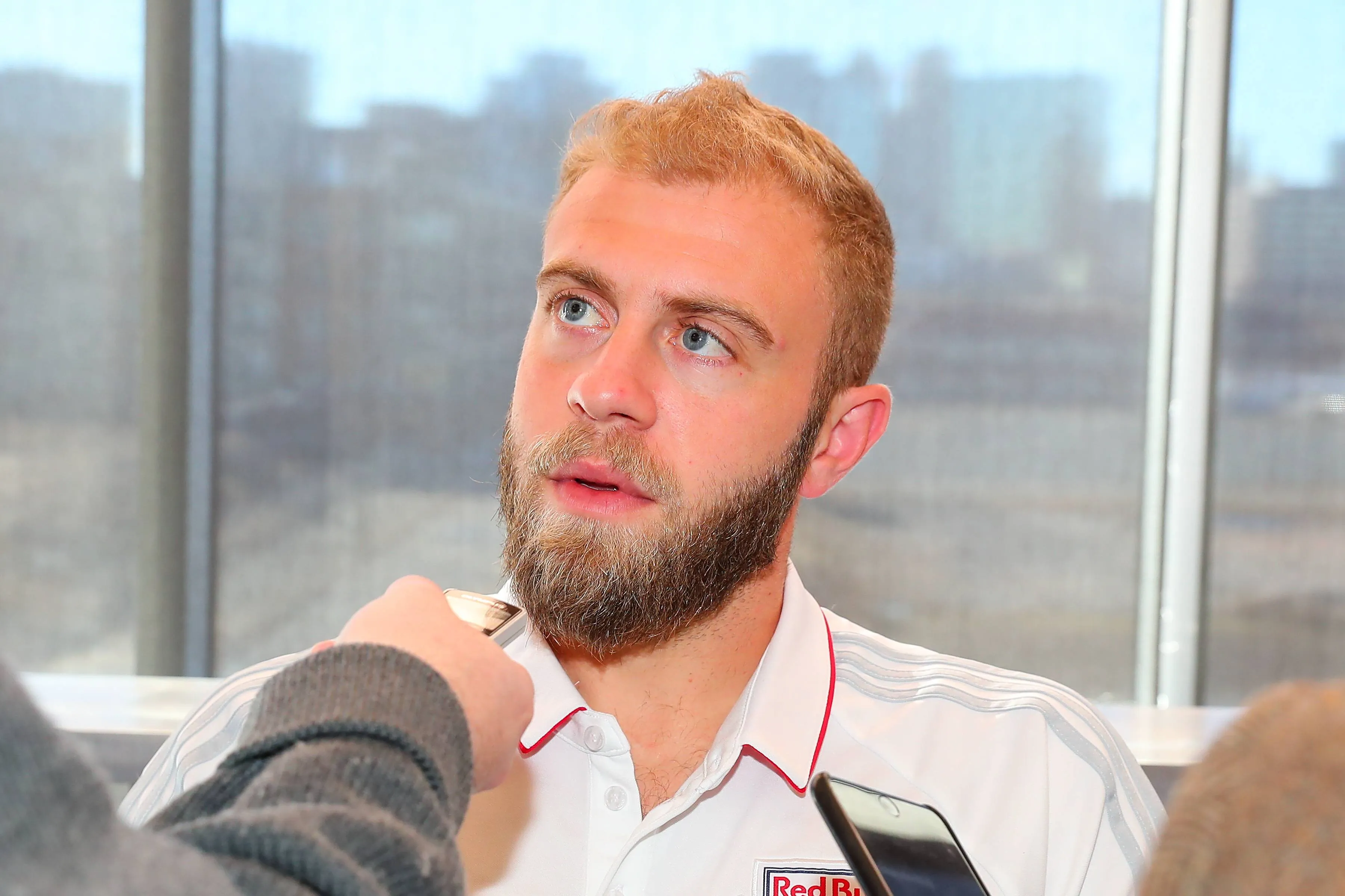 Mike Grella answers questions from members of the media during New York Red Bulls Media Day