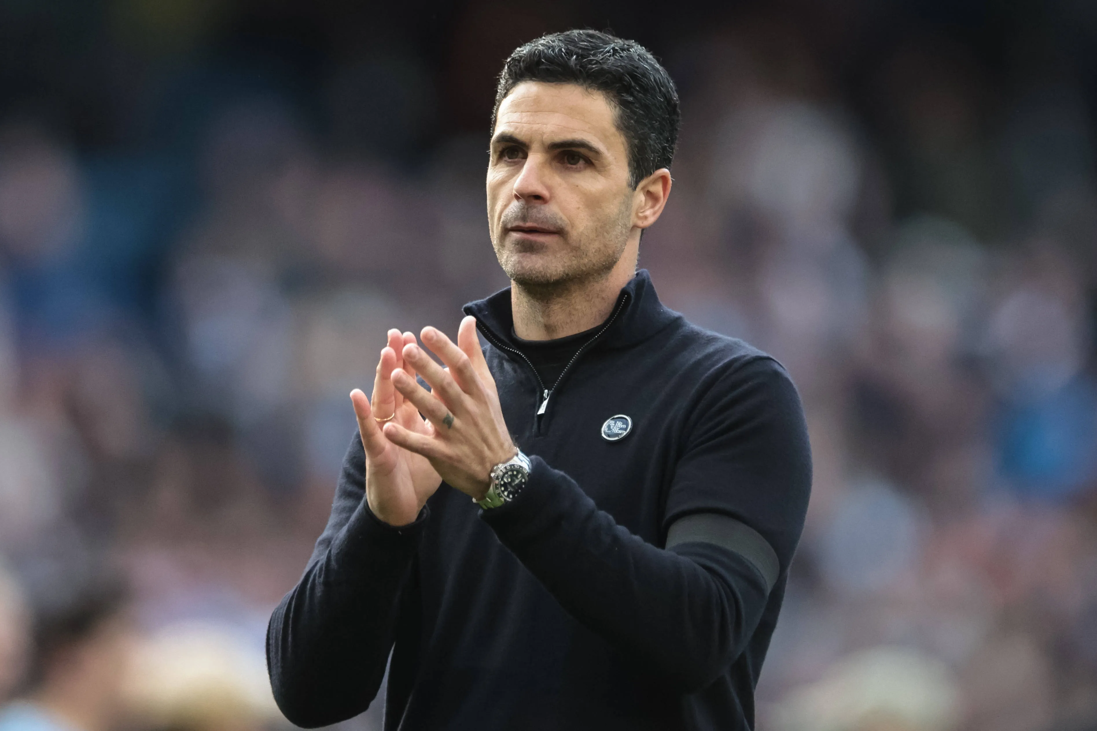 Mikel Arteta, manager of Arsenal, applauds the fans