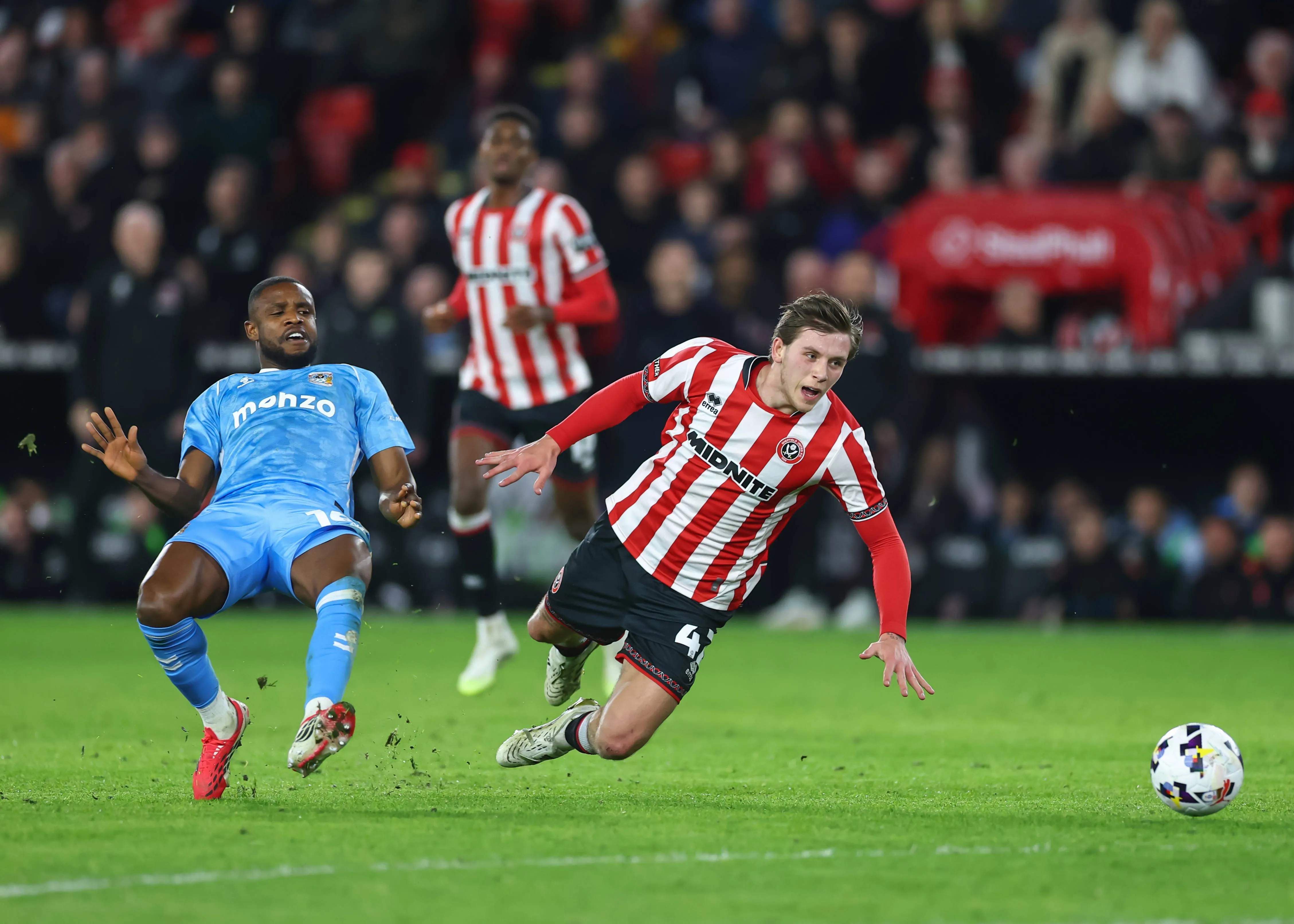 Frank Onyeka of Coventry City tackles Sydie Peck of Sheffield United during the Sheffield United vs Coventry City