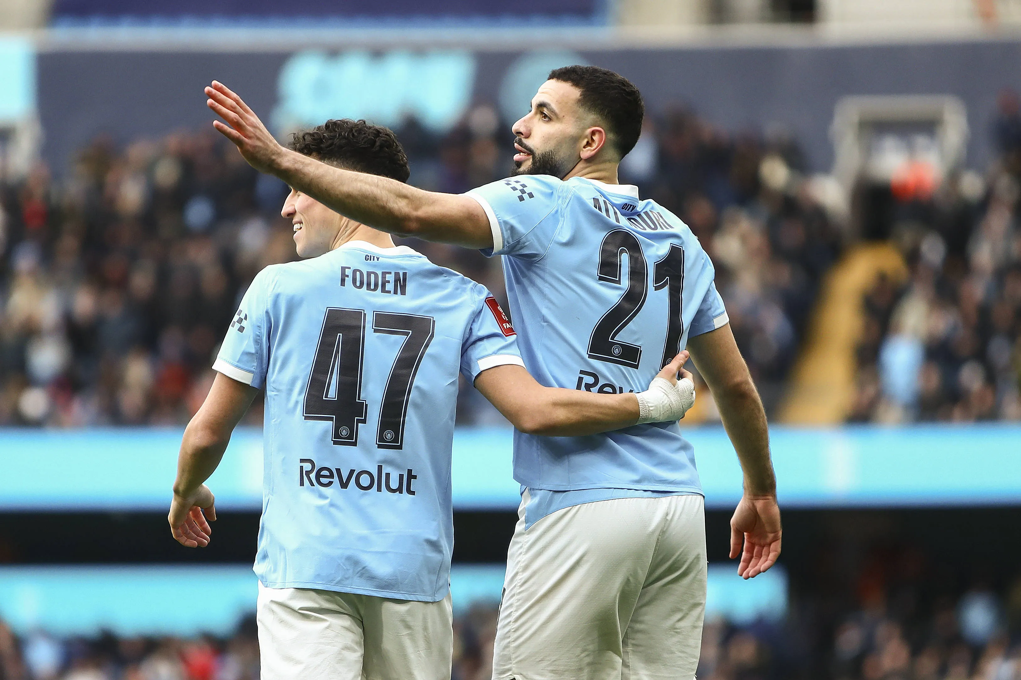 Rayan Ait-Nouri and Phil Foden of Manchester City celebrate as Omar Marmoush of Manchester City scores a GOAL 1-0 during the Manchester City v Salford City Emirates FA Cup 4th Round match at the Etihad Stadium, Manchester, England on 14 February 2026