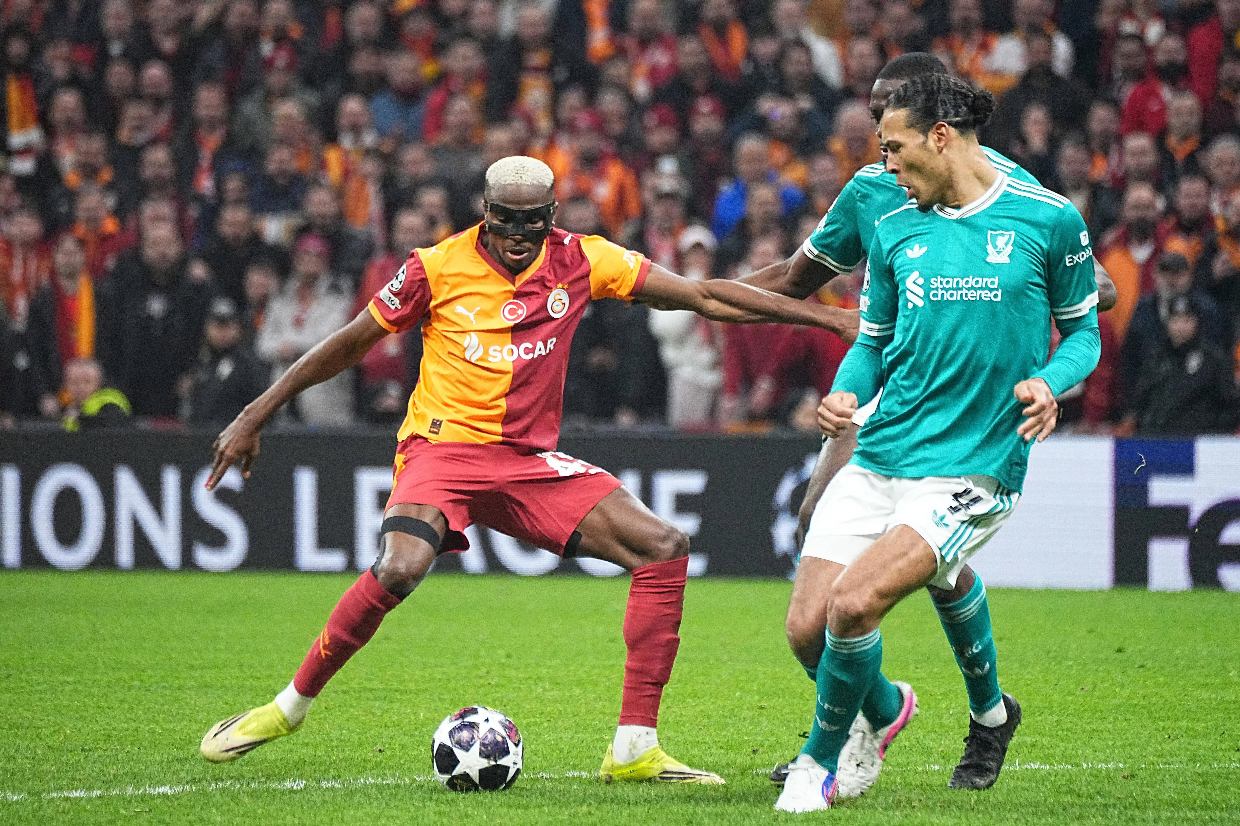 Victor Osimhen of Galatasaray and Virgil van Dijk of Liverpool FC battle for the ball