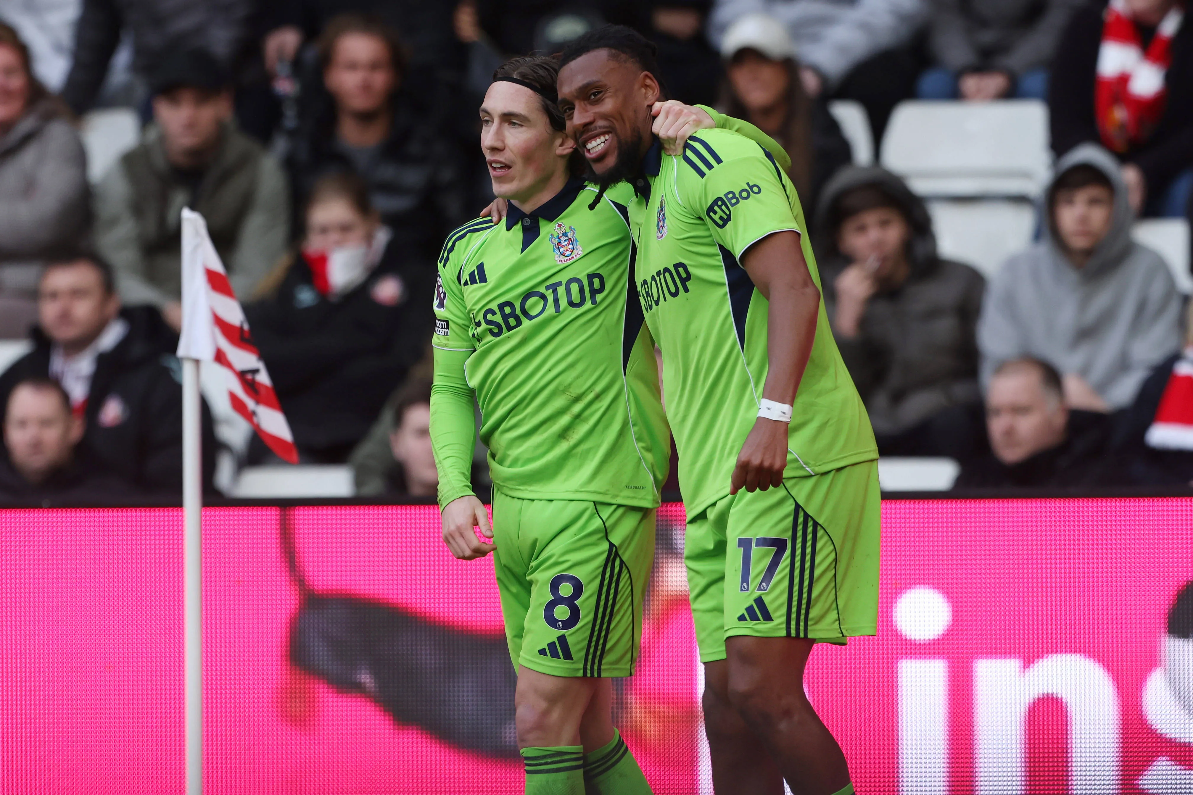 Alex Iwobi celebrates with Harry Wilson after scoring their third goal during the Premier League match between Sunderland and Fulham at the Stadium Of Light