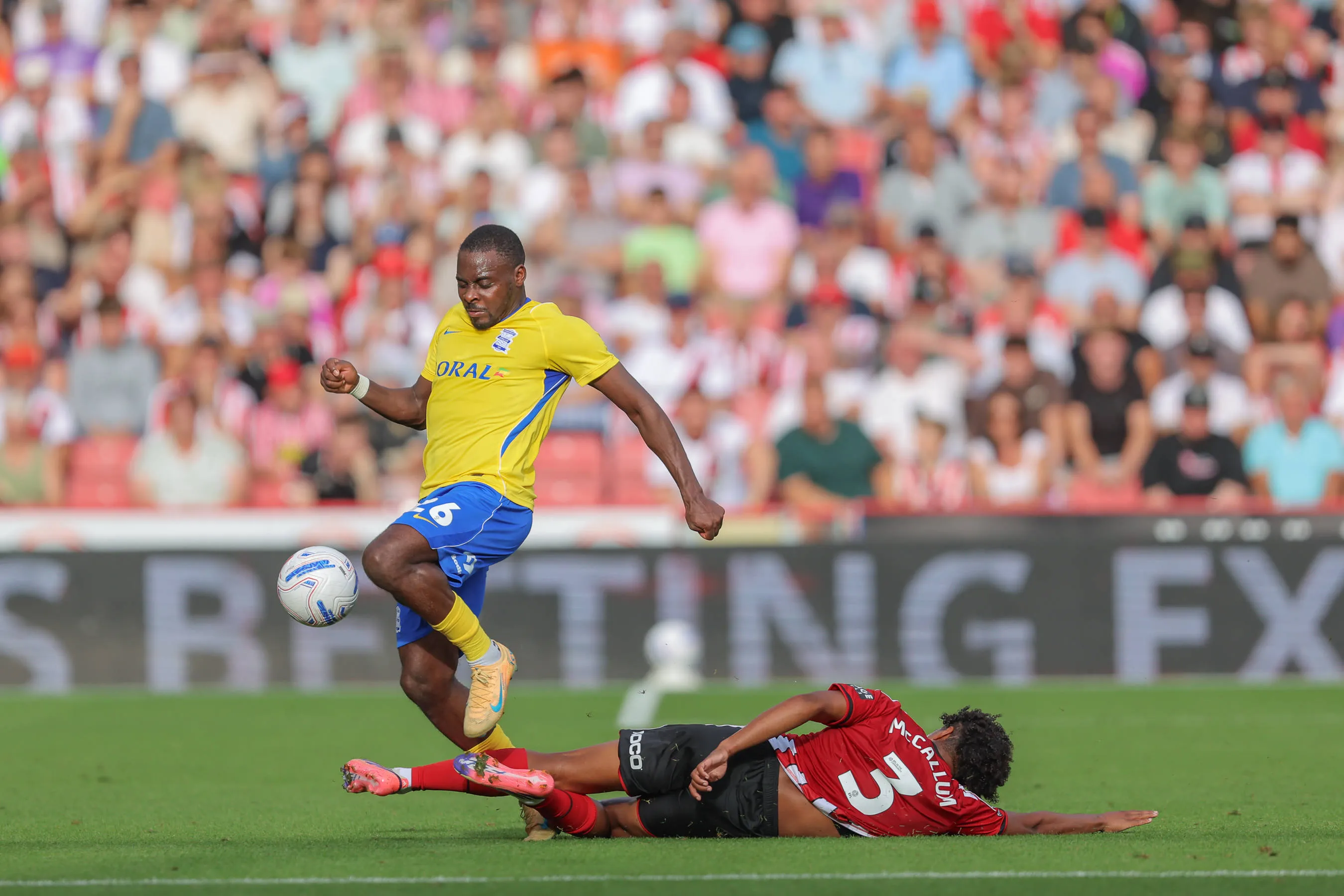 Bright Osayi-Samuel tackled by Sam McCallum