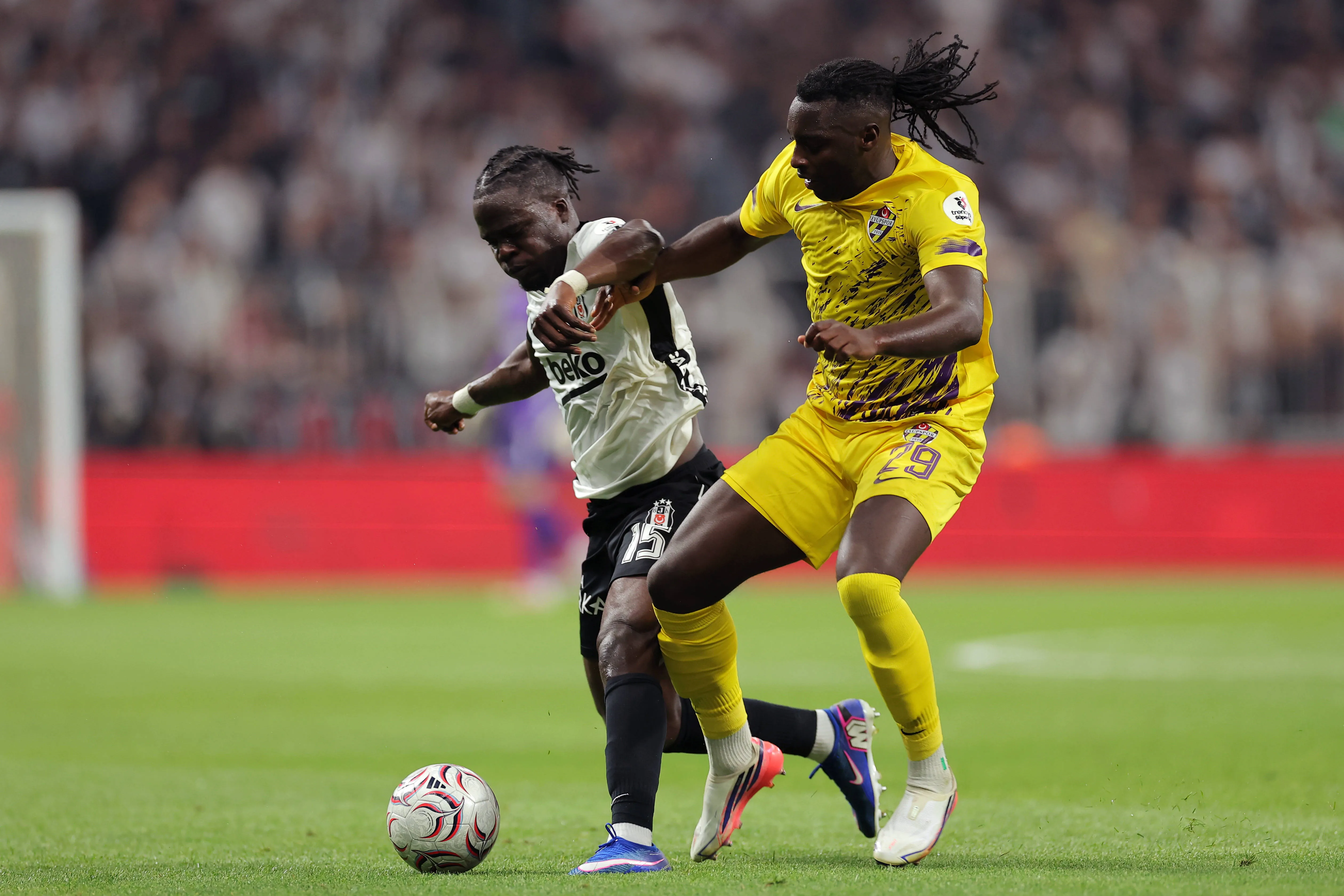 Junior Olaitan of Besiktas battles Ahmed Abdullahi of Eyupspor