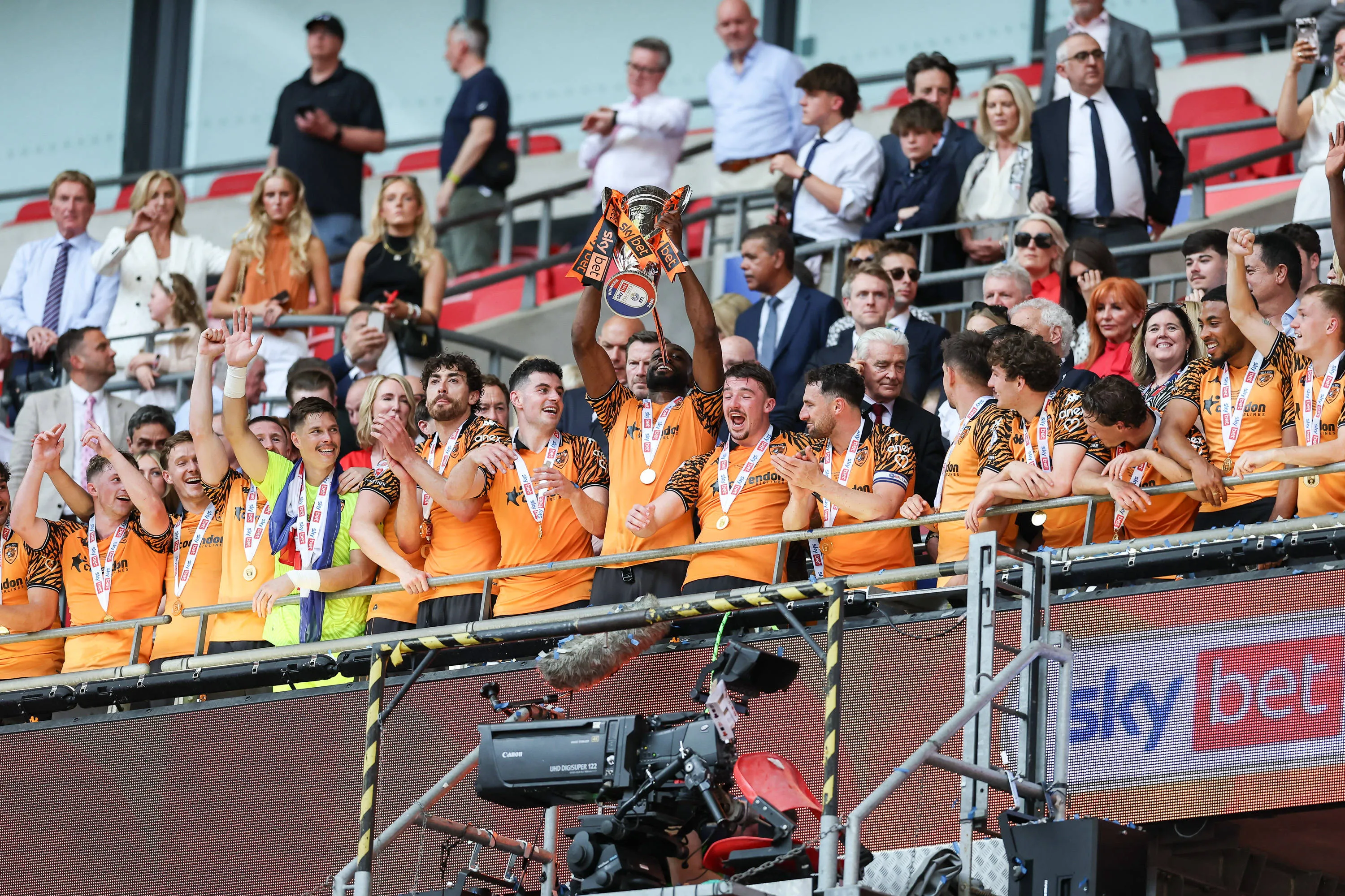 Hull City defender Semi Ajayi lifts the Championship playoff trophy
