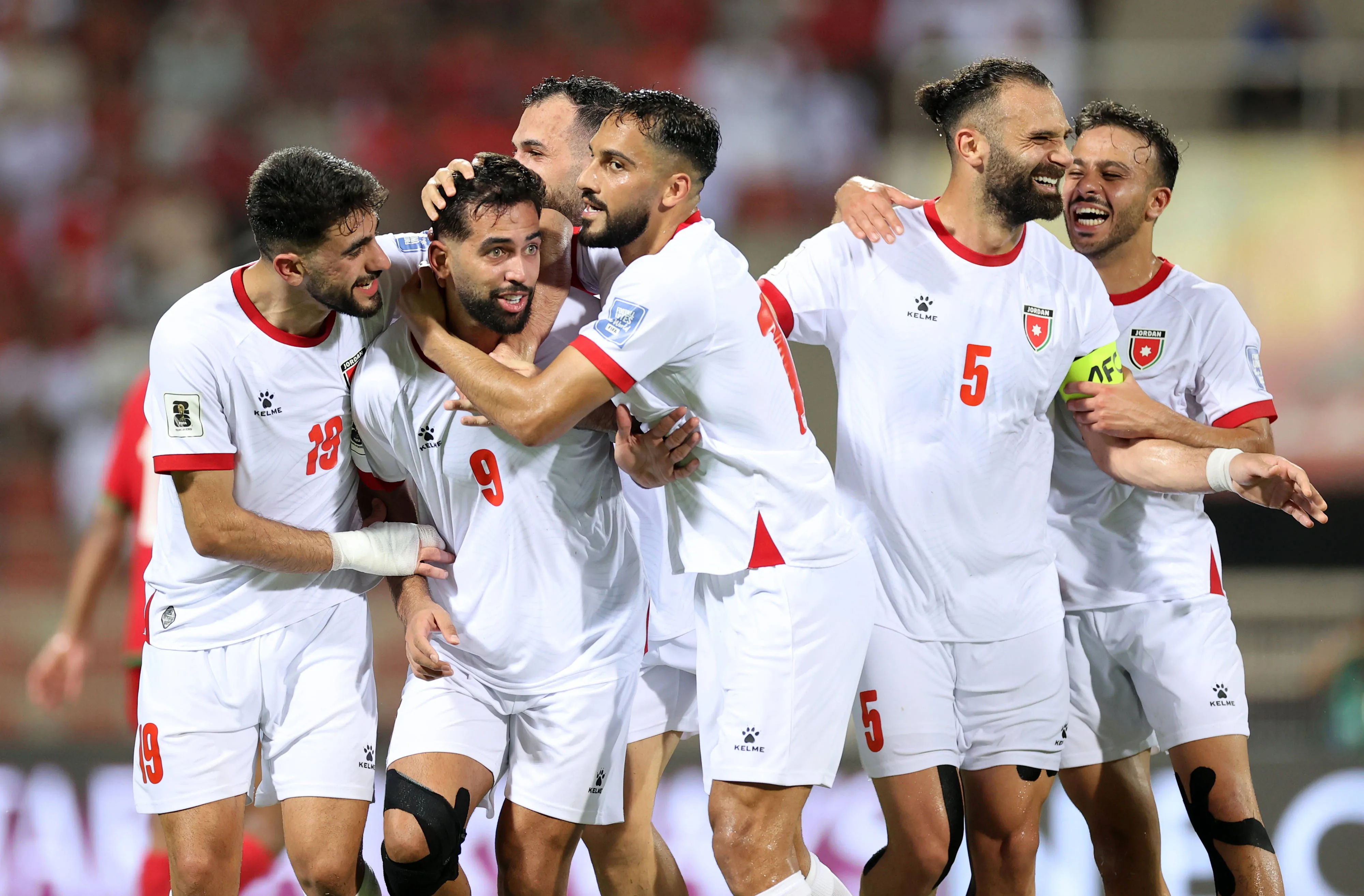 Jordan s players Ali Olwan, Mousa Al-Tamari, Amer Jamous, and Yazan Al-Arab celebrate their team goal