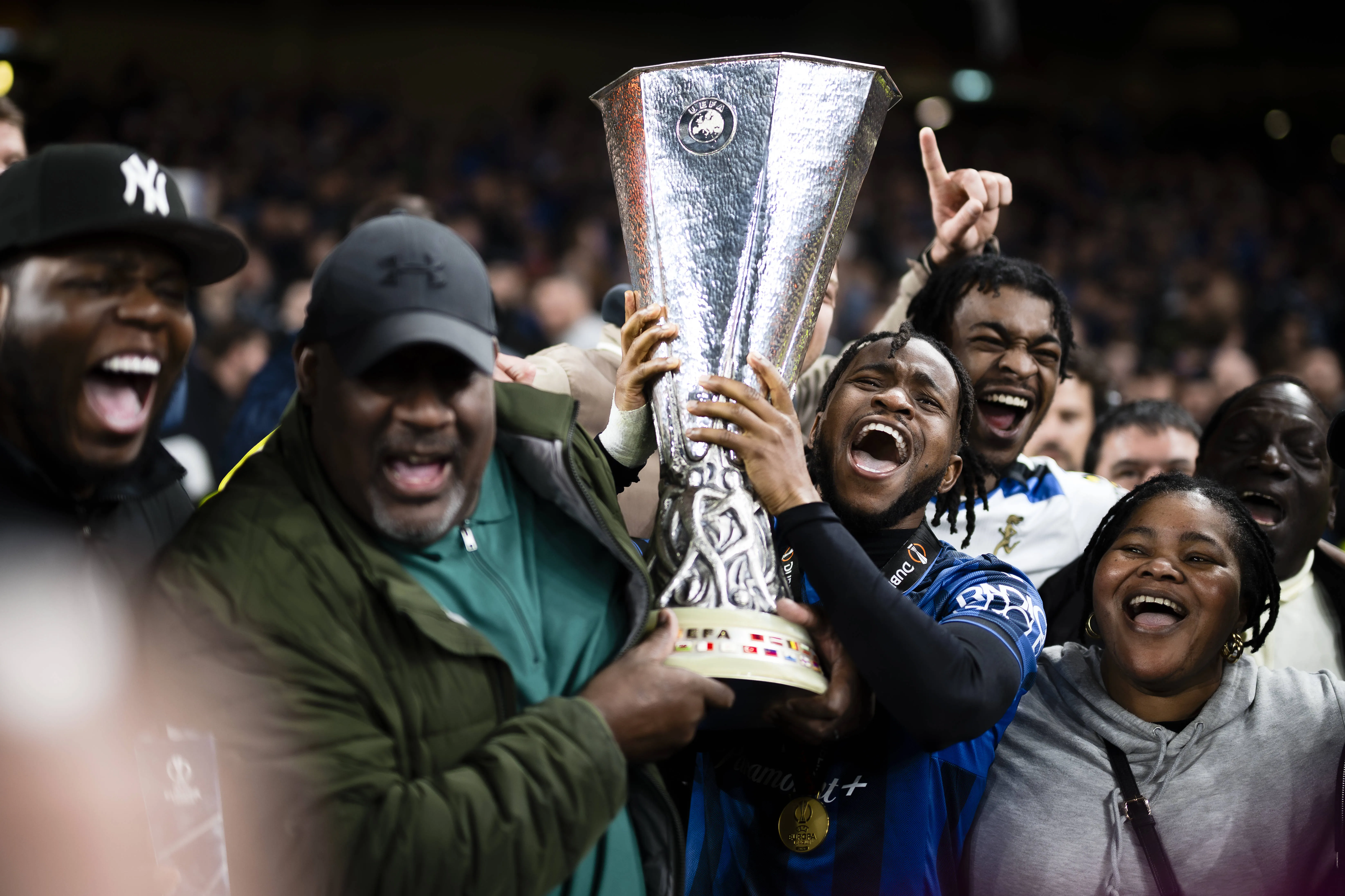 Ademola Lookman celebrates with the Europa League trophy