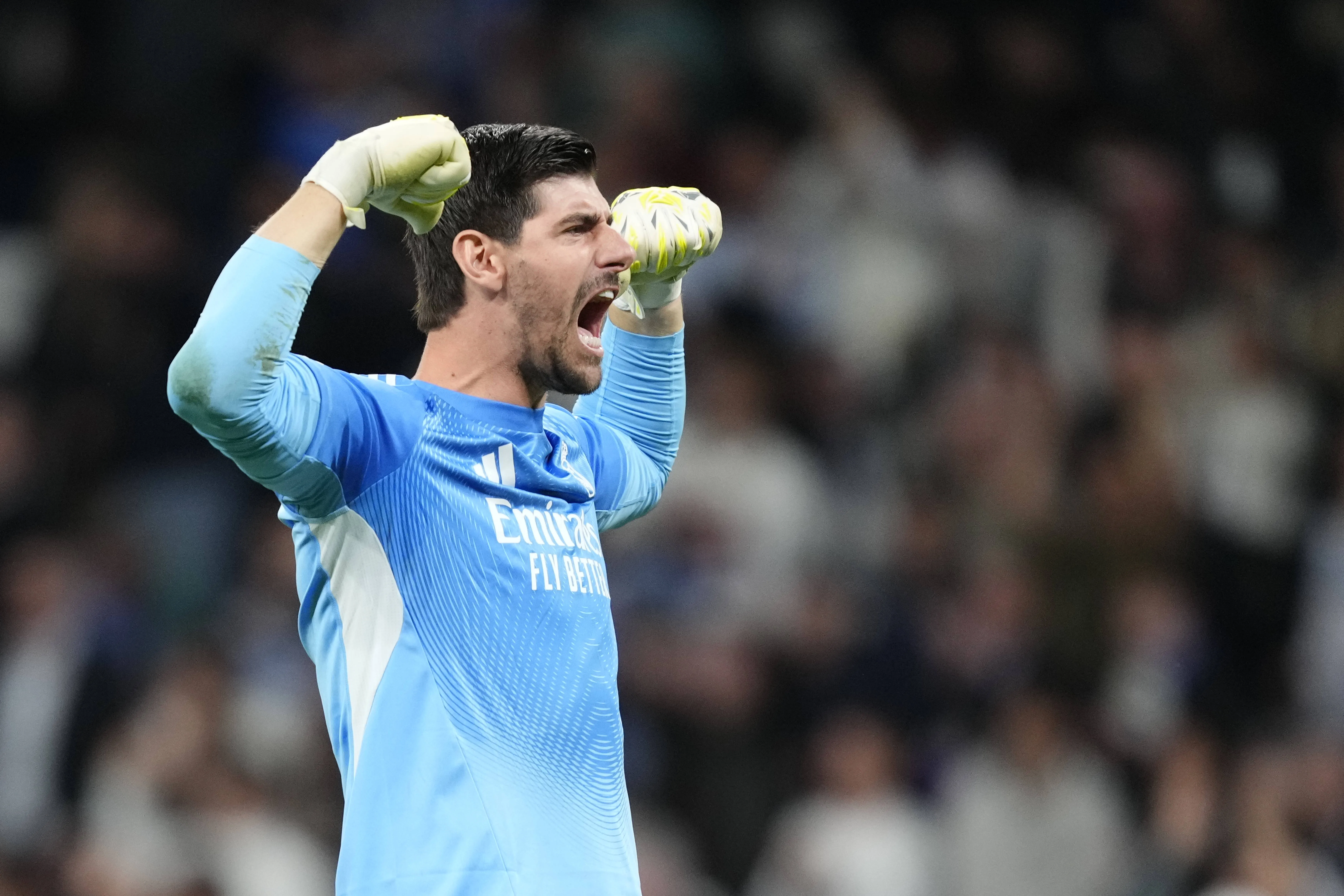 Thibaut Courtois goalkeeper of Real Madrid and Belgium celebrates the victory after winning the UEFA Champions League 2025/26 Round of 16 First Leg match between Real Madrid CF and Manchester City FC