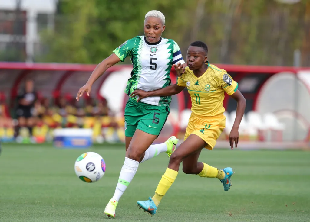Chrestinah Thembi Kgatlana of South Africa challenged by Onome Ebi of Nigeria