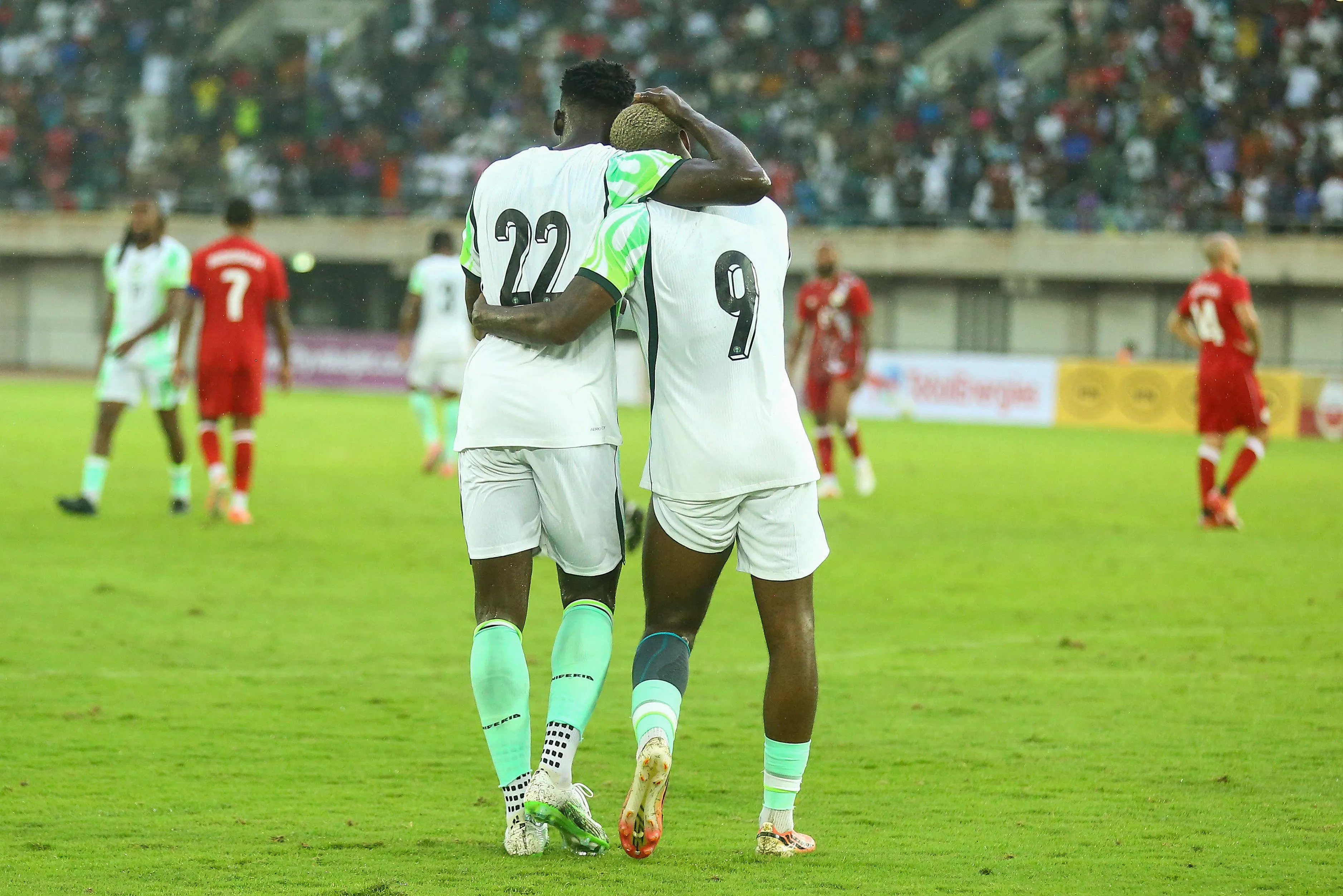 George Ilnikhena and Akor Adams in action for the Super Eagles of Nigeria