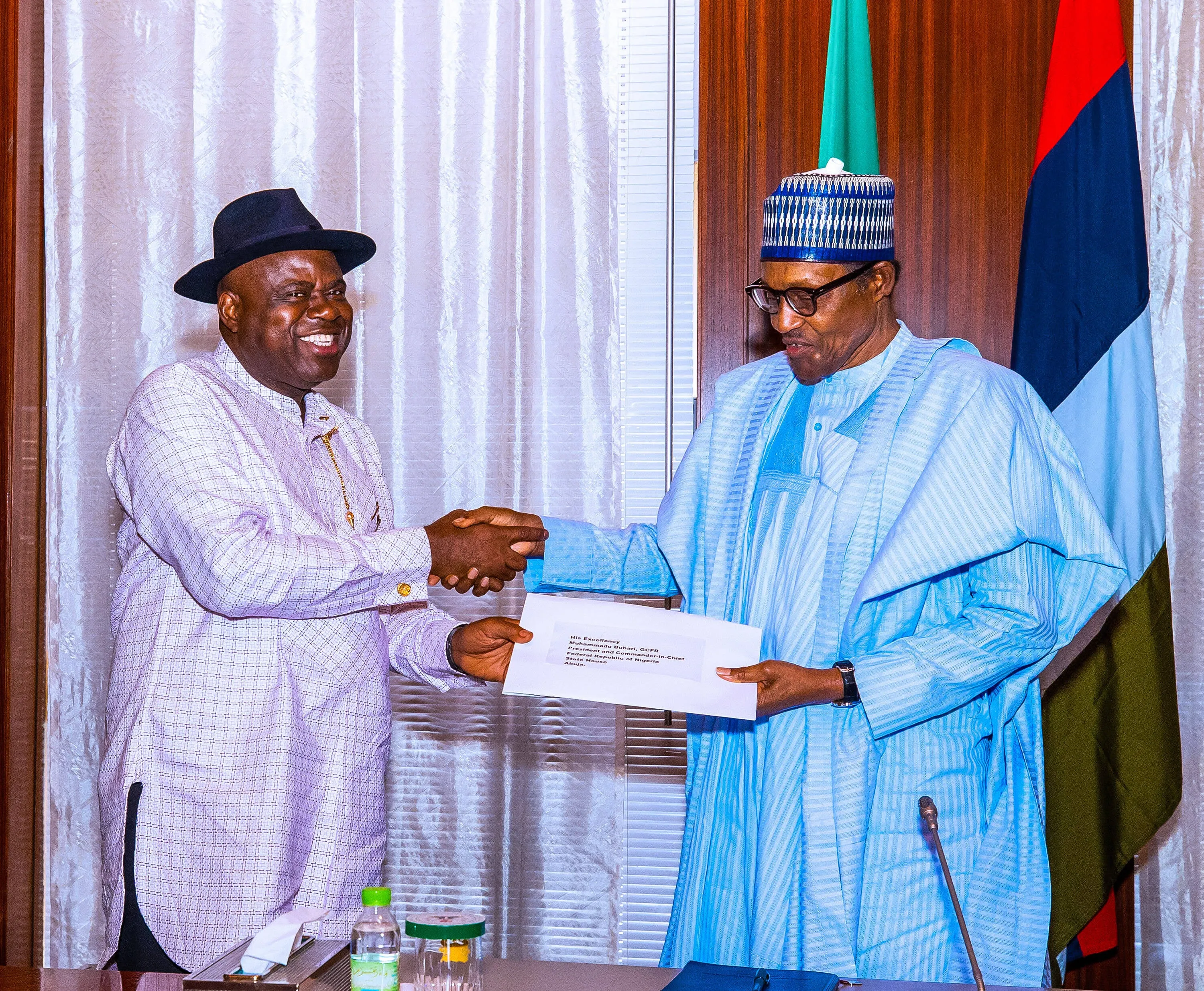 Governor Duoye Diri and late President Muhammadu Buhari (right) 