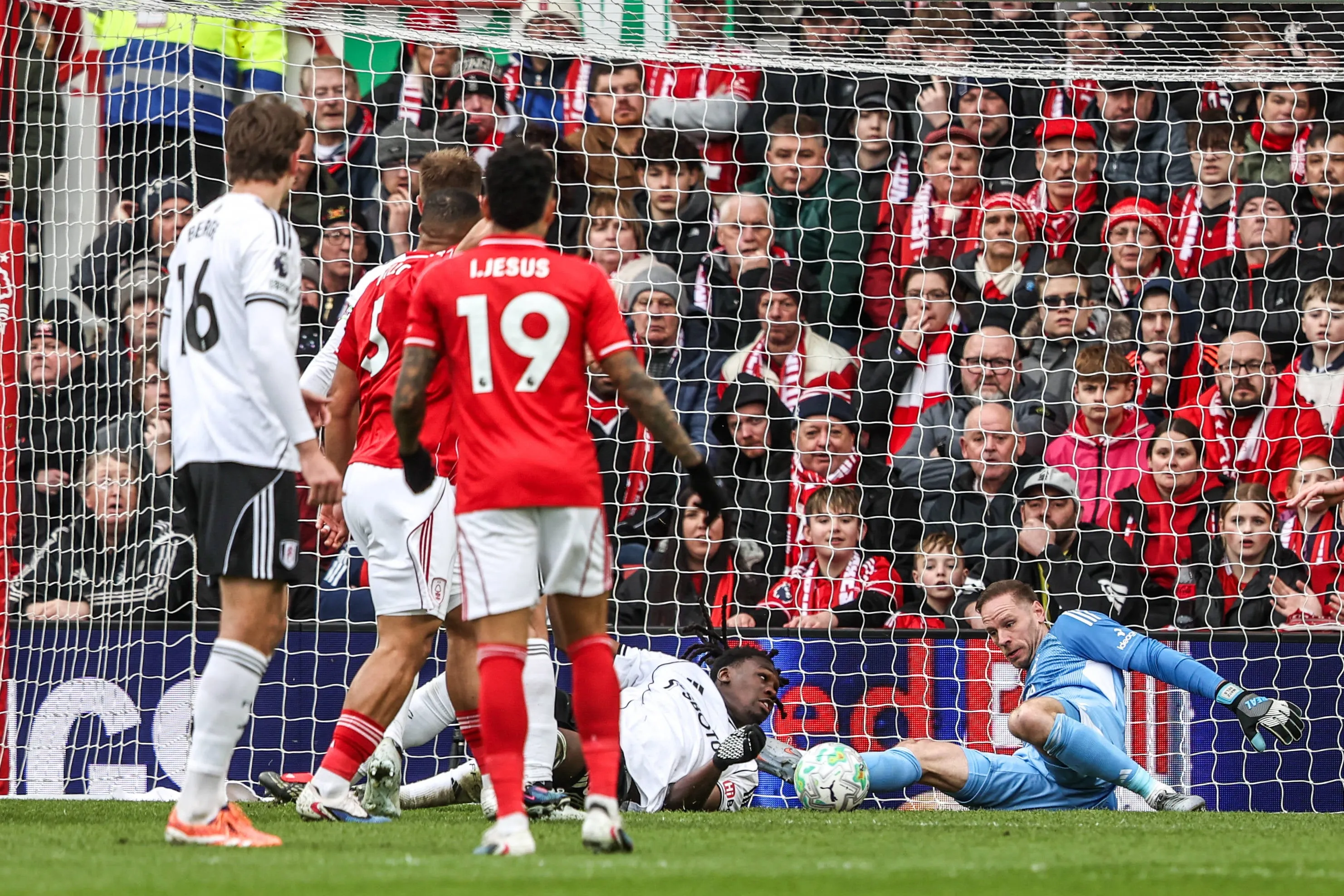 Ibrahim Sangare saves a shot from Calvin Bassey during the Premier League match between Nottingham Forest and Fulham at City Ground in Nottingham