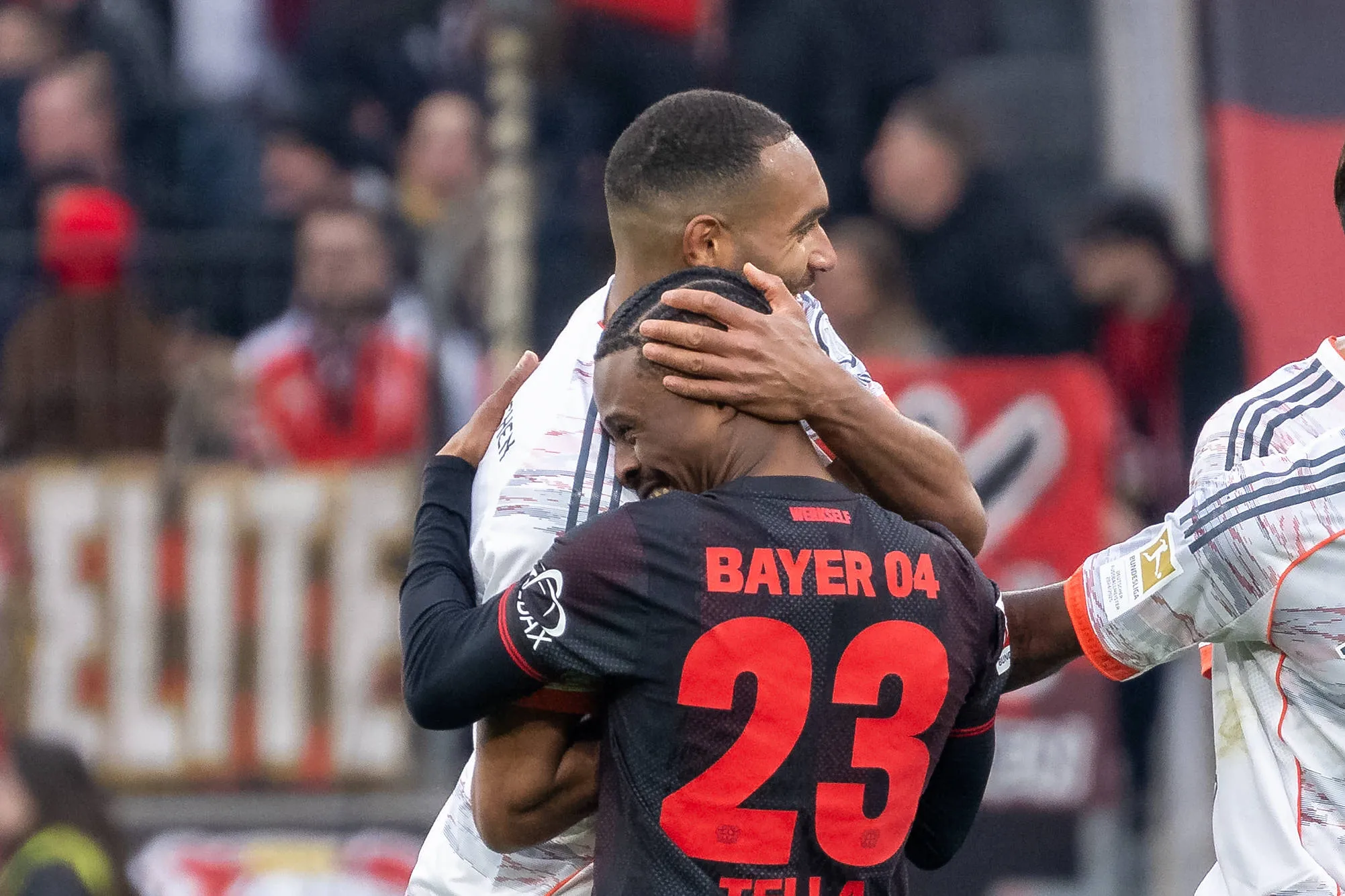 Jonathan Tah, Bayern Muenchen, and Nathan Tella, Bayer 04 Leverkusen.  