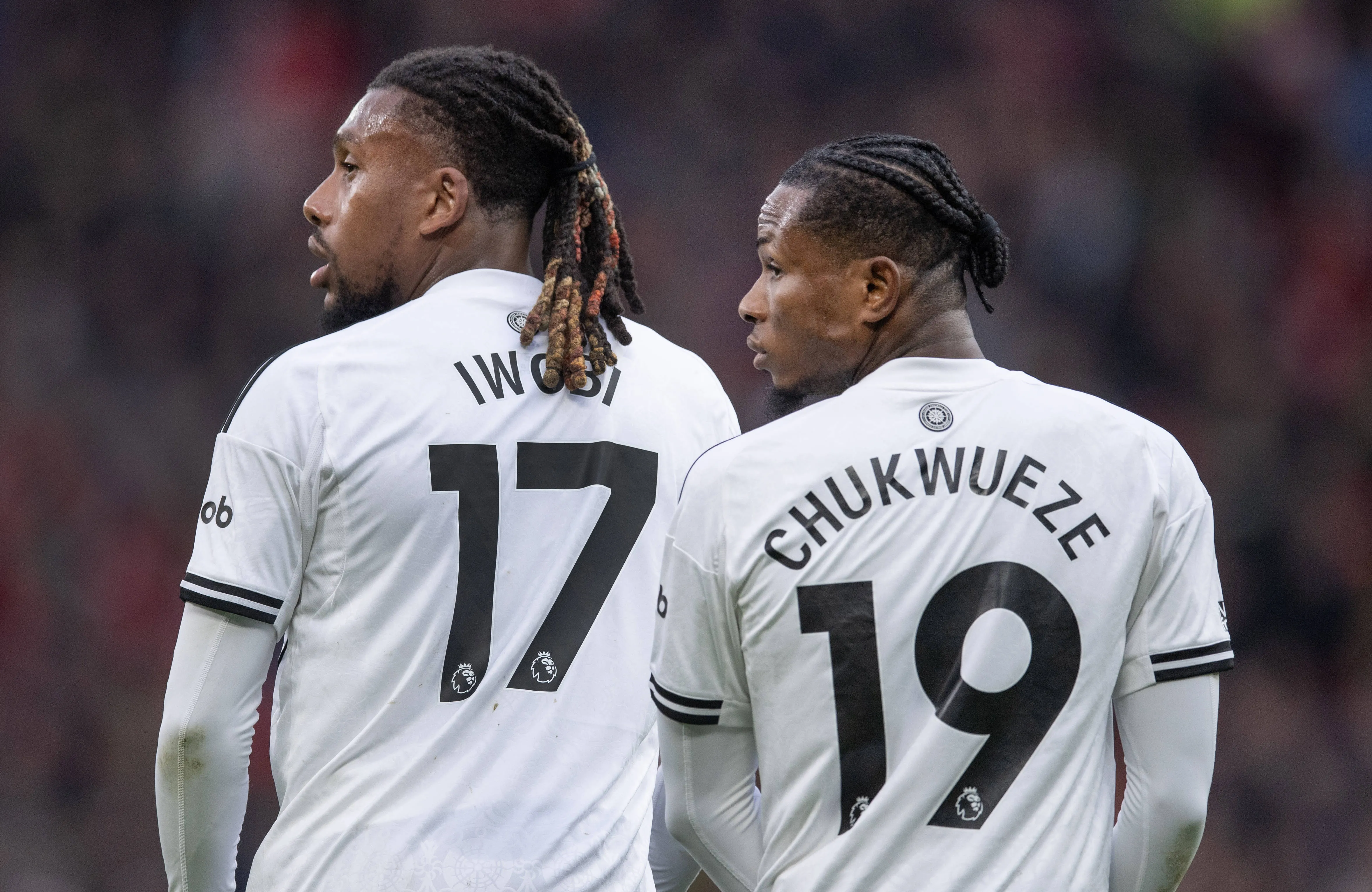 Alex Iwobi and Samuel Chukwueze during the Premier League match between Manchester United and Fulham at Old Trafford