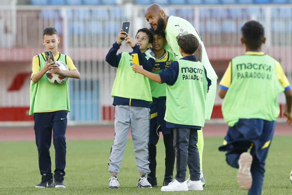 Algeria's Rais M'bohli hanging out with ball boys