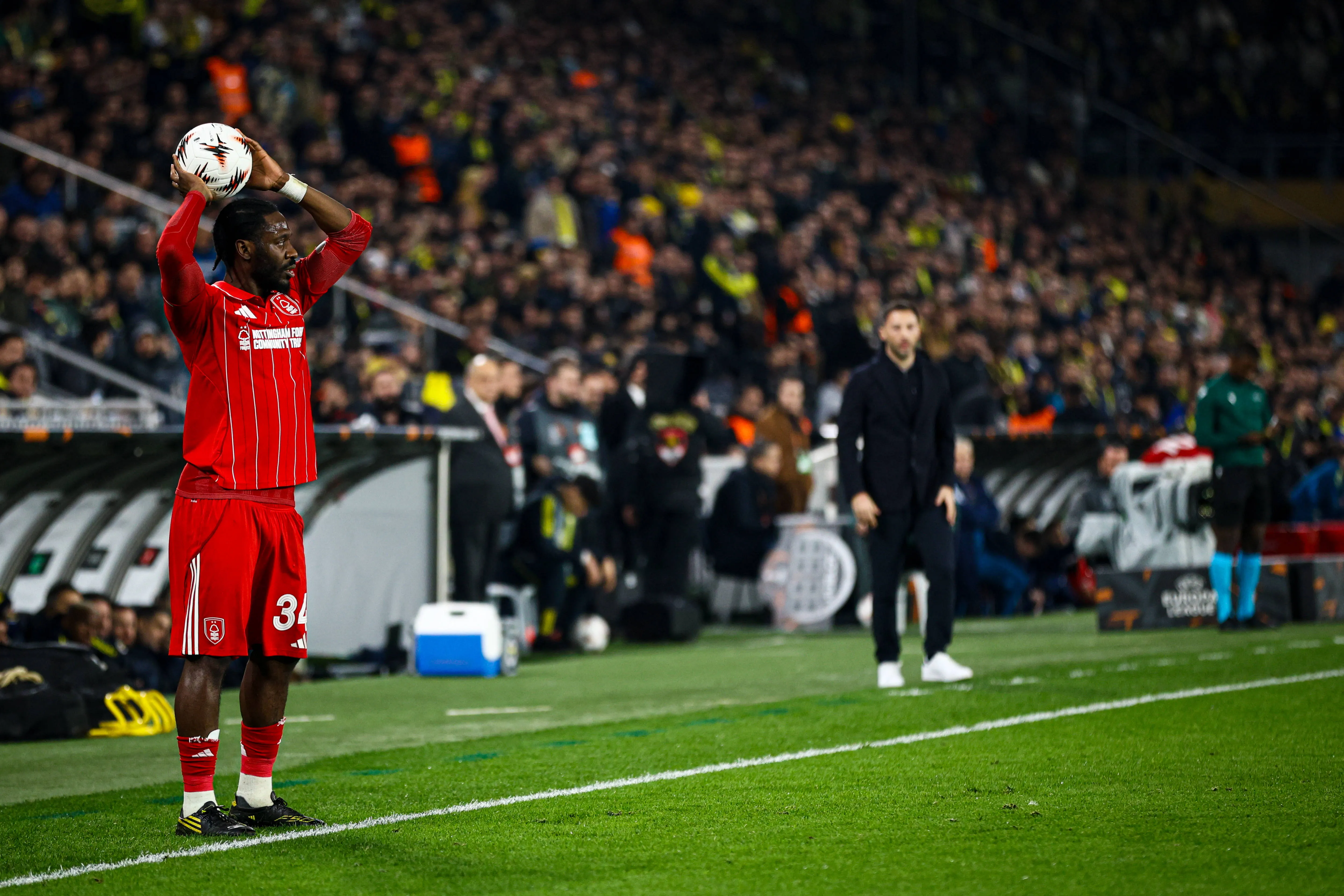 Ola Aina takes a throw-in during the match