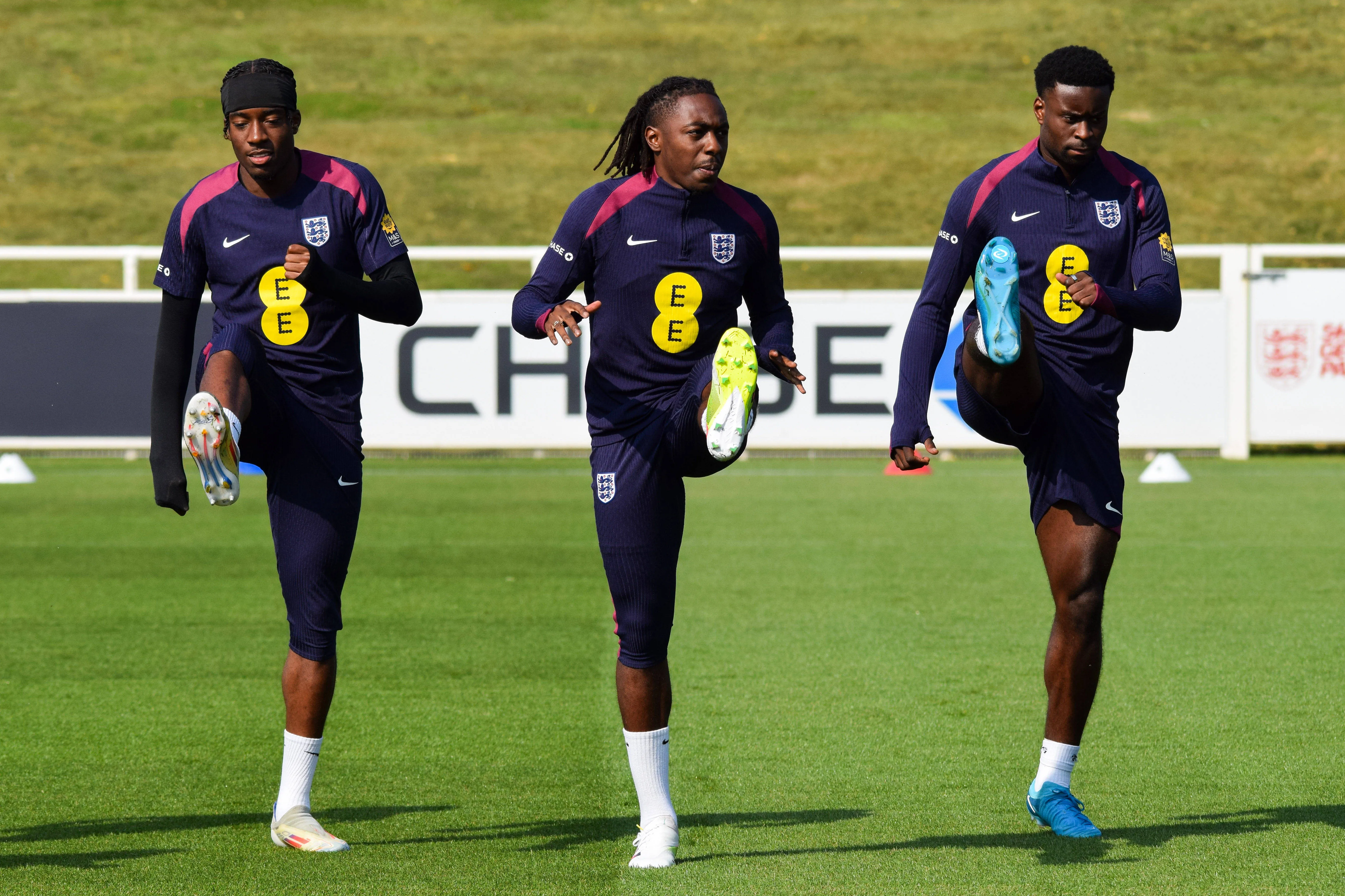 England Training England forward Noni Madueke, England forward Eberechi Eze and England defender Marc Guehi warm up during the England Training session ahead of the Republic of Ireland match