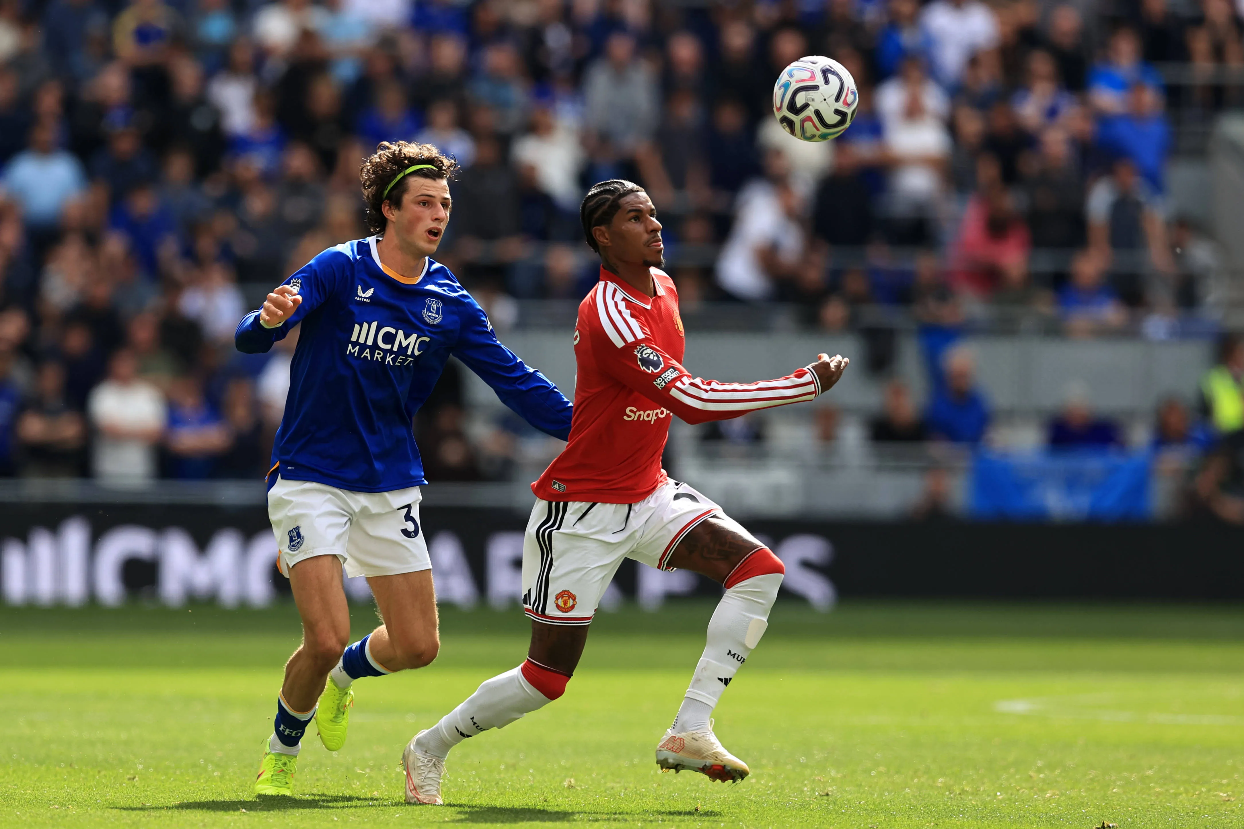 Marcus Rashford of Manchester United is challenged by Merlin Rohl of Everton