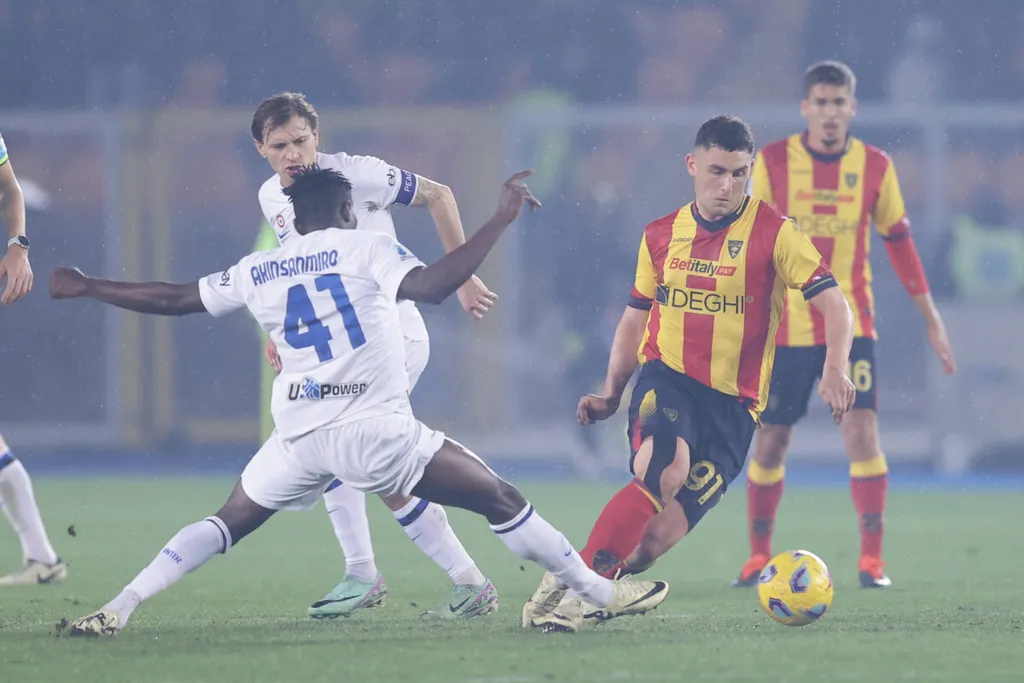 Serie a football match Lecce vs Inter Inter™s Nigerian midfielder Ebenezer Akinsanmiro challenges for the ball with Lecc
