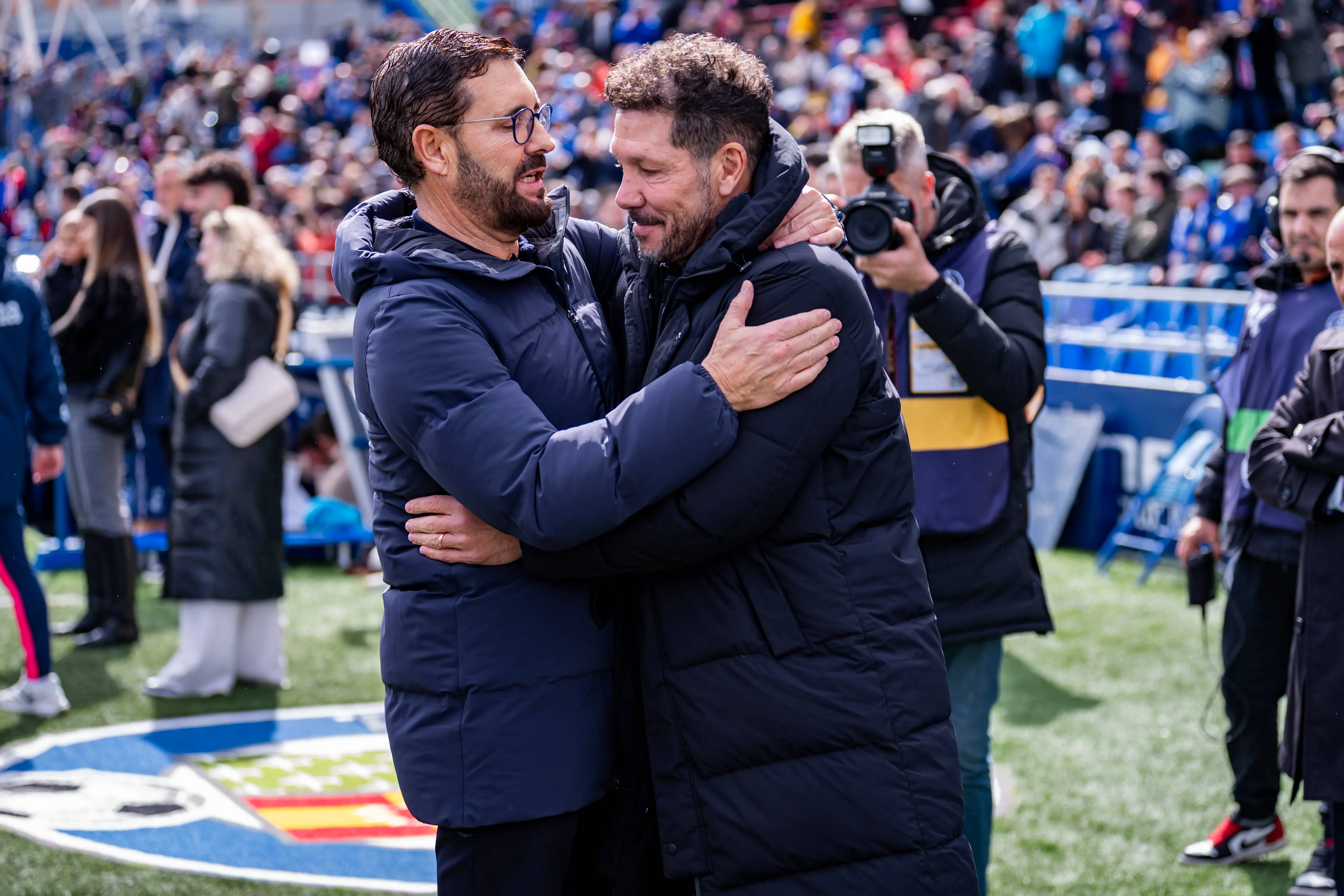 Jose Bordalas, head coach of Getafe CF hugs Diego Pablo Simeone head coach of Atletico de Madrid